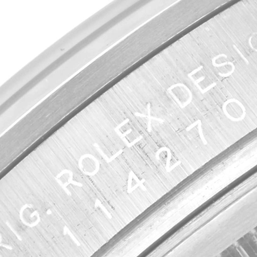 This close-up image shows the engraved side of the bezel on a Rolex Explorer 114270 Men
s Stainless Steel Black Dial 114270 Men
s Stainless Steel Black Dial watch.
