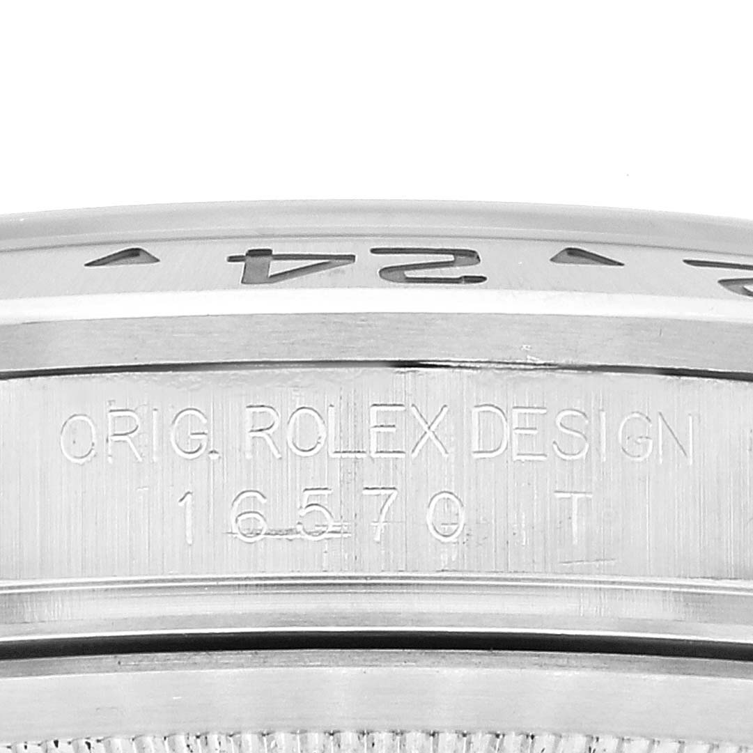 The image shows a close-up angle of the engraved case and bezel of the Rolex Explorer 16570 Men's Stainless Steel White Dial 16570 Men's Stainless Steel White Dial watch model 16570T.