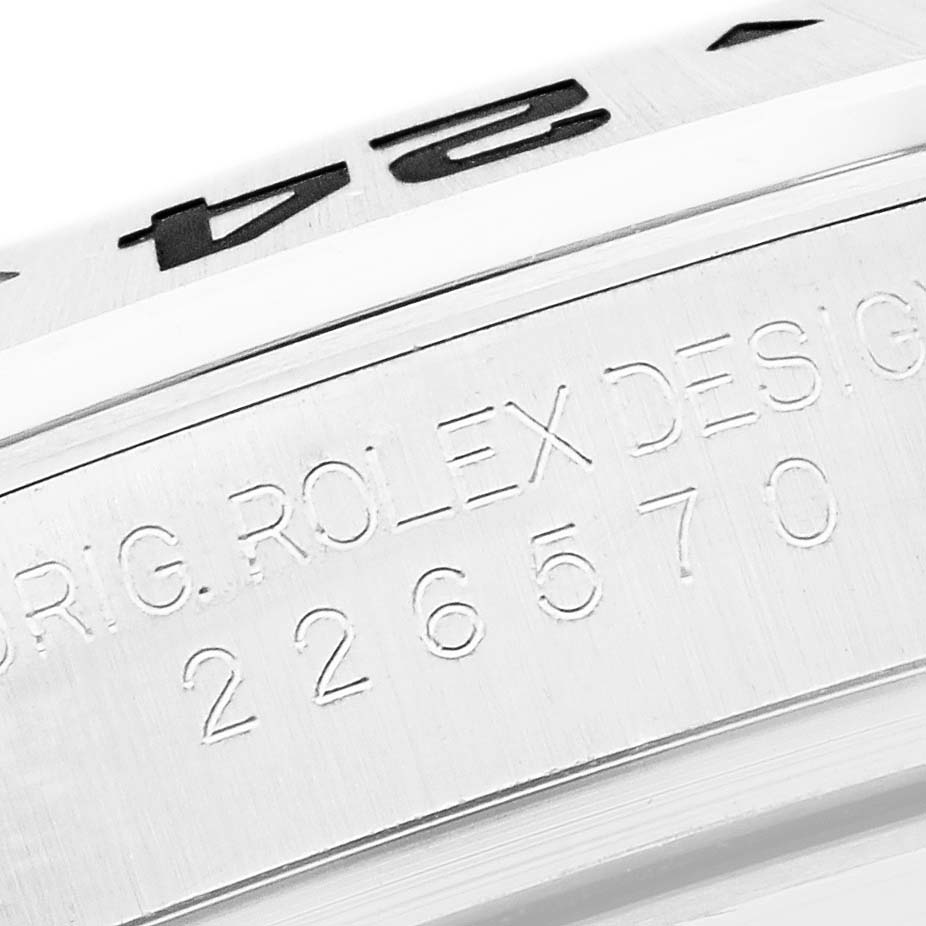 The image shows the side of a Rolex Explorer M226570-0002 Men's Stainless Steel Black Dial M226570-0002 Men's Stainless Steel Black Dial watch, highlighting the engraved model number and "ROLEX DESIGN".