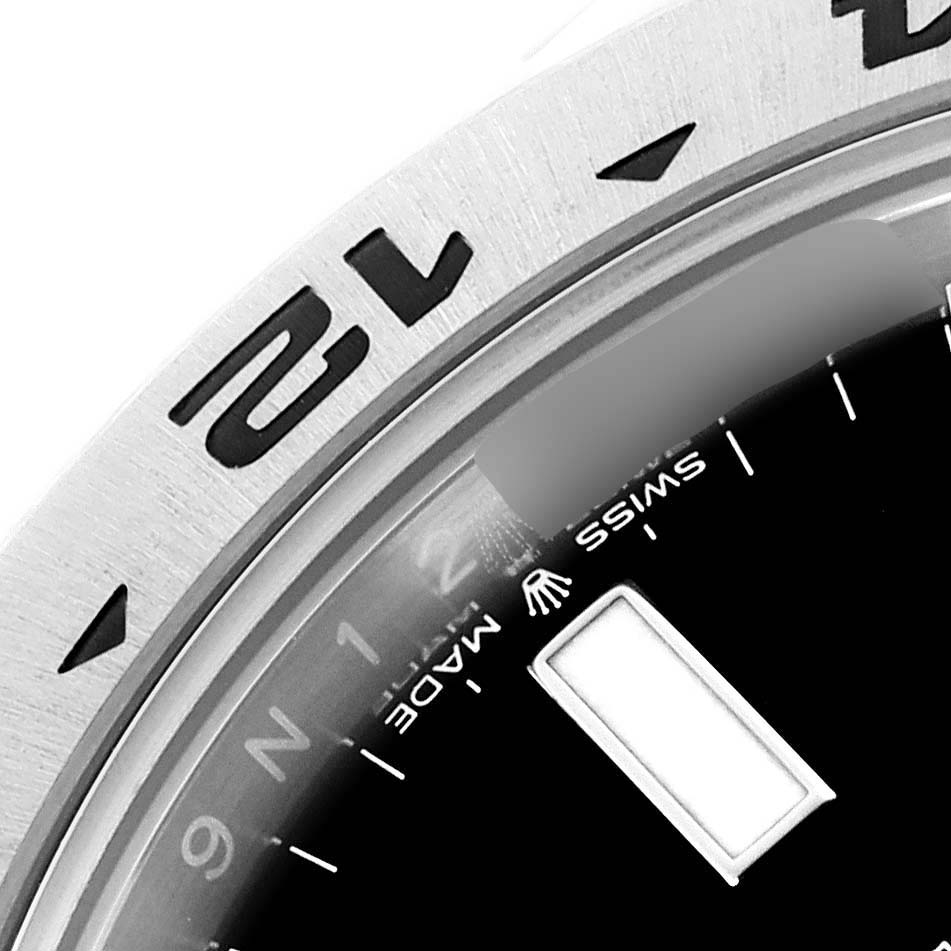 This image shows a close-up of the bezel and partial dial of the Rolex Explorer M226570-0002 Men's Stainless Steel Black Dial M226570-0002 Men's Stainless Steel Black Dial watch, highlighting the "Swiss Made" text.