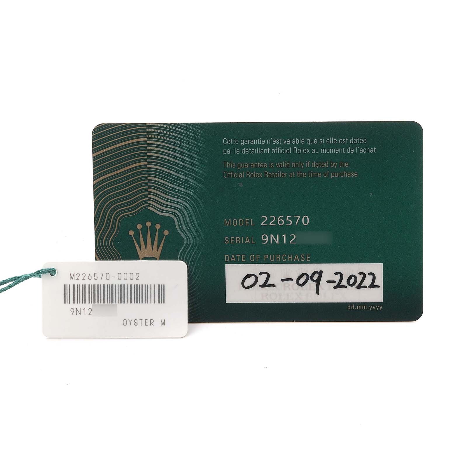 The image shows a Rolex Explorer M226570-0002 Men's Stainless Steel Black Dial M226570-0002 Men's Stainless Steel Black Dial model guarantee card with purchase date and serial tag.