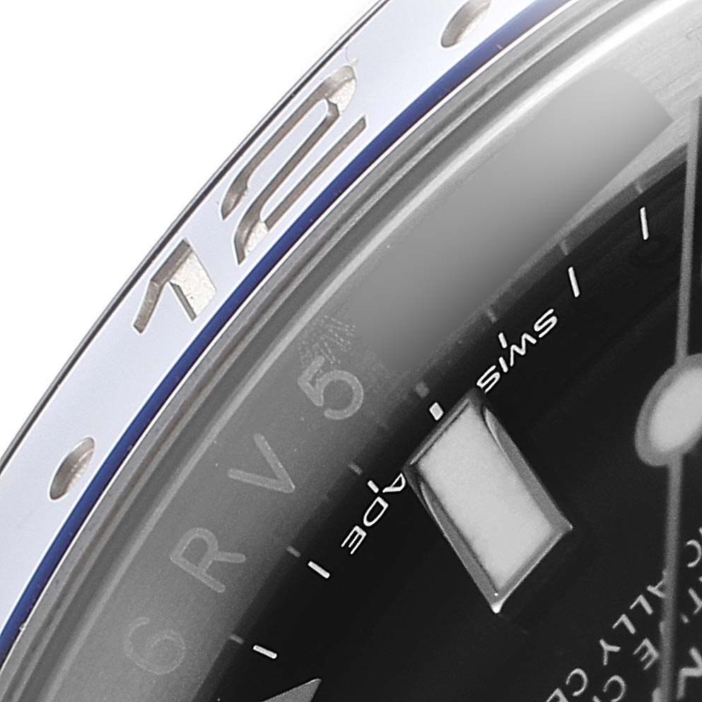 Close-up of the Rolex GMT-Master 116710 Men
s Stainless Steel Black Dial 116710 Men
s Stainless Steel Black Dial
s bezel and partially visible dial.