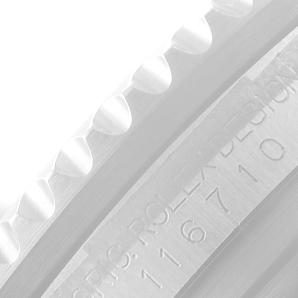 This image shows a close-up of the bezel and the serial engraving on the case of a Rolex GMT-Master 116710 Men
s Stainless Steel Black Dial 116710 Men
s Stainless Steel Black Dial watch.