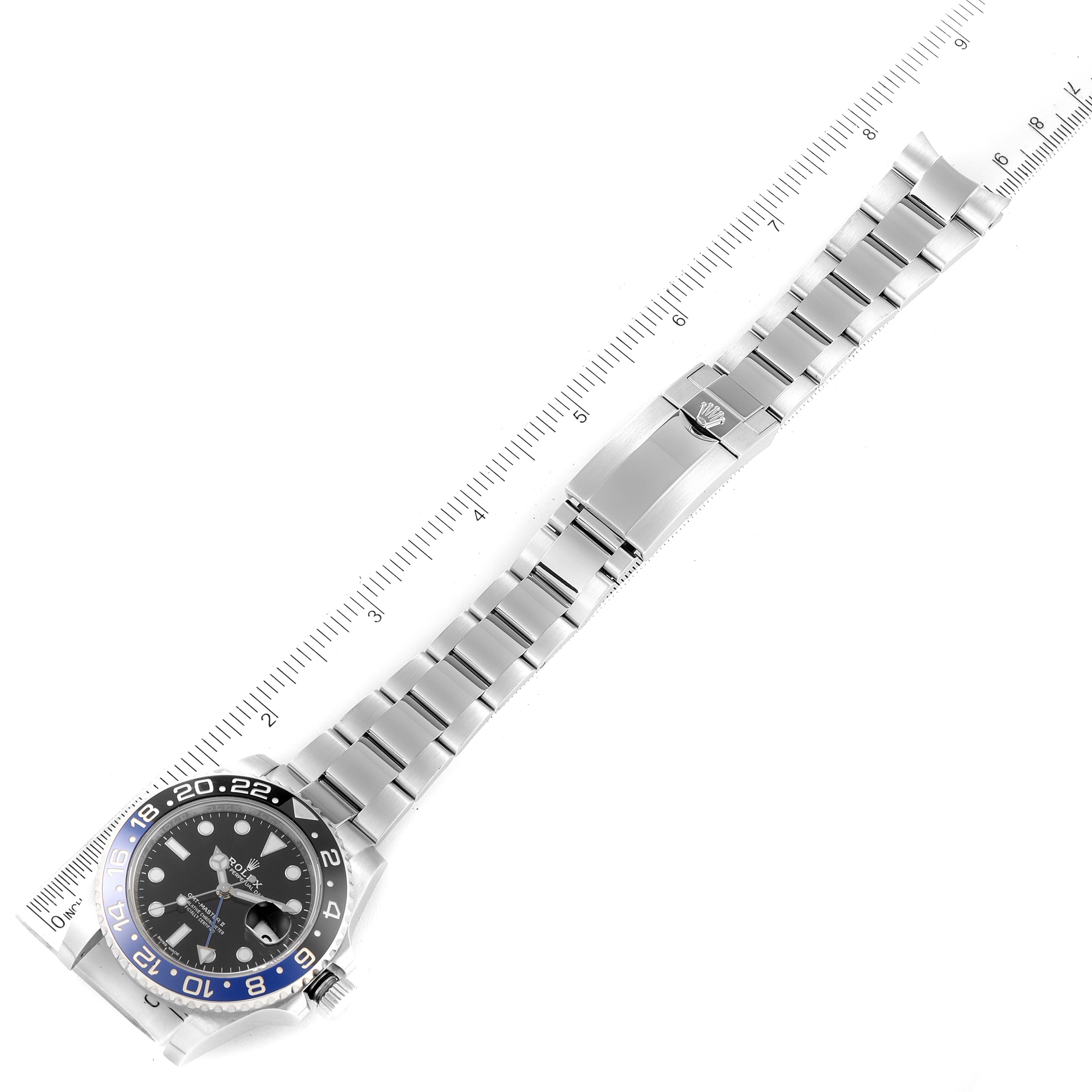 The image shows a top-down view of a Rolex GMT-Master 116710 Men
s Stainless Steel Black Dial 116710 Men
s Stainless Steel Black Dial watch, featuring the face, bezel, and full bracelet with a ruler for scale.
