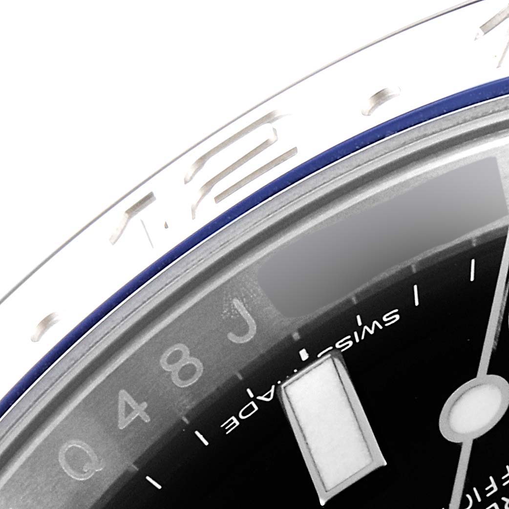The image shows a close-up of the dial, bezel, and part of the minute hand and hour markers of a Rolex GMT-Master 116710 Men
s Stainless Steel Black Dial 116710 Men
s Stainless Steel Black Dial watch.