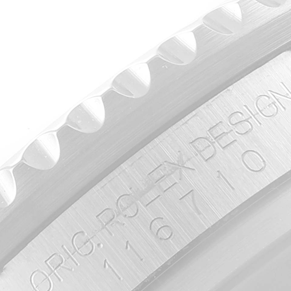 This close-up image shows part of the bezel and case of a Rolex GMT-Master 116710 Men
s Stainless Steel Black Dial 116710 Men
s Stainless Steel Black Dial watch, highlighting the model number engraving.