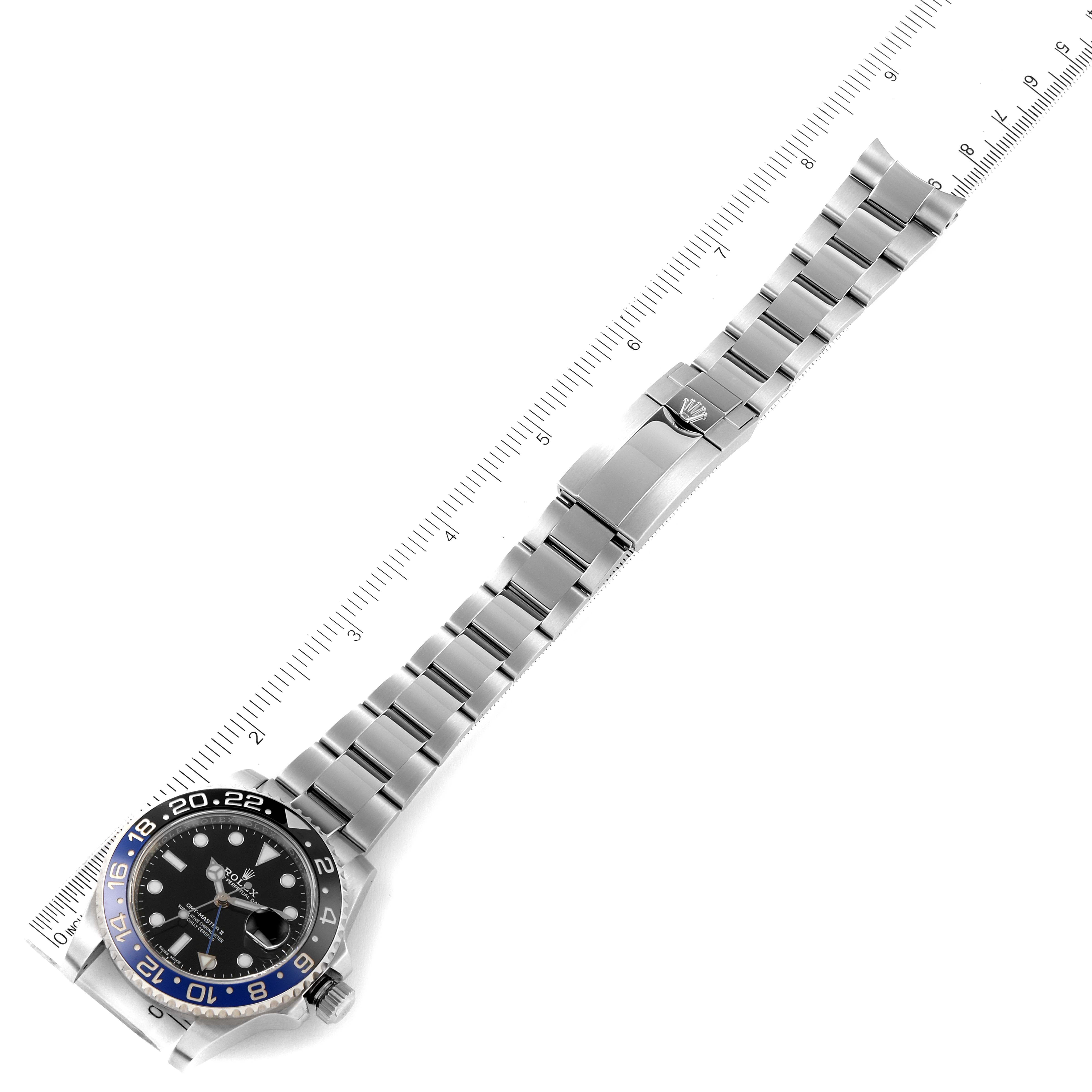 The image shows a top-down view of a Rolex GMT-Master 116710 Men
s Stainless Steel Black Dial 116710 Men
s Stainless Steel Black Dial watch, highlighting its face, bracelet, and folding clasp.