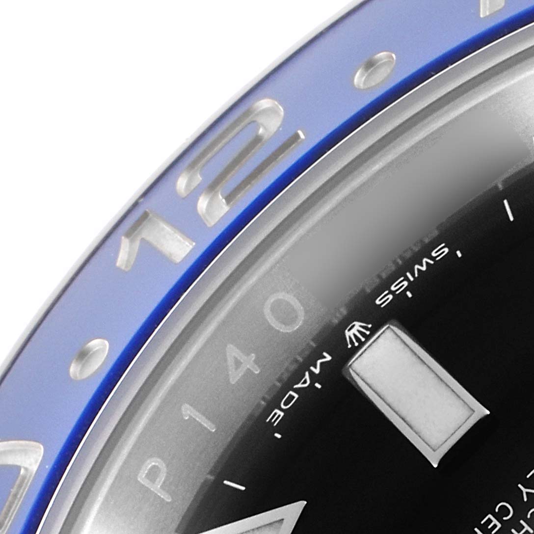 The image shows a close-up of the bezel and part of the dial of a Rolex GMT-Master 126710 Men
s Stainless Steel Black Dial 126710 Men
s Stainless Steel Black Dial watch.