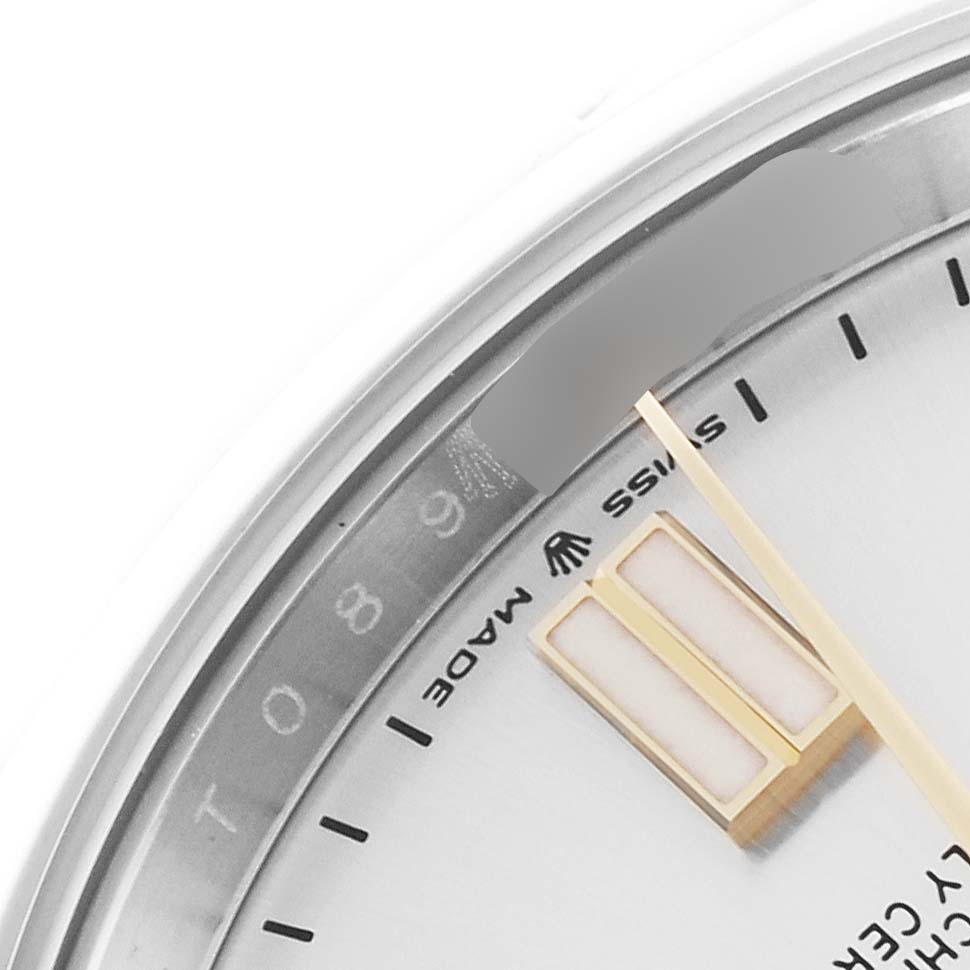 The image shows a close-up of the dial and hands of a Rolex Oyster Perpetual 124300 Men's Stainless Steel Silver Dial 124300 Men's Stainless Steel Silver Dial watch, highlighting the "SWISS MADE" text.