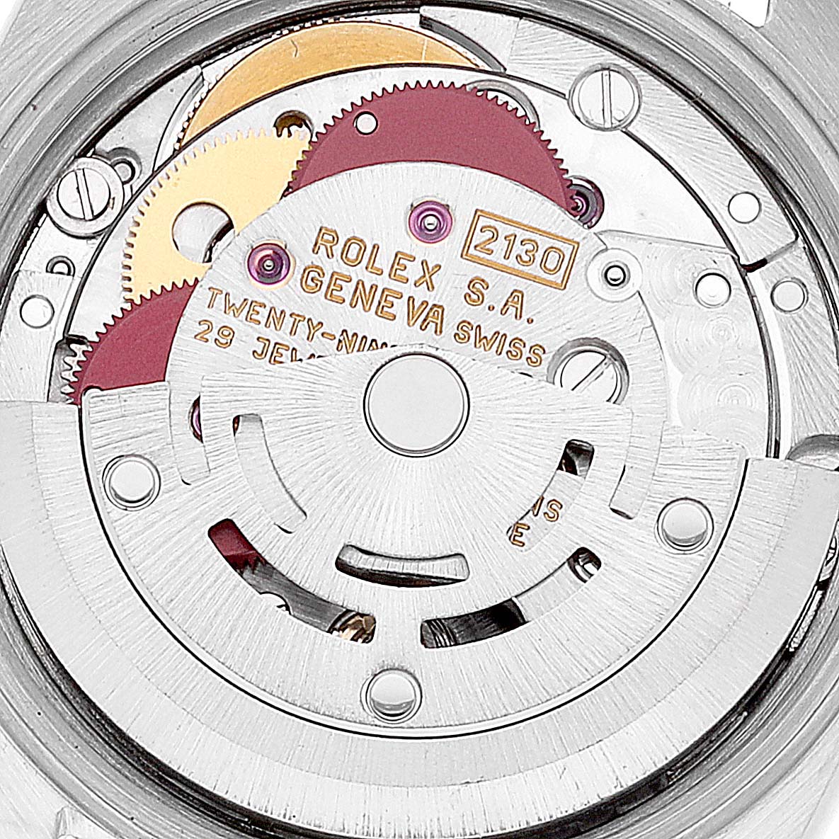 The image shows a close-up of the internal mechanism of a Rolex Oyster Perpetual 67193 Women's Steel and Gold (two tone) Champagne Dial 67193 Women's Steel and Gold (two tone) Champagne Dial watch, highlighting its gears and rotor.