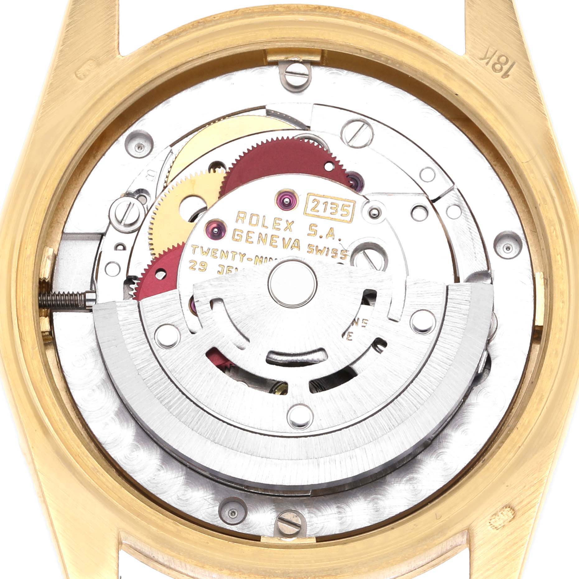 The image shows the movement and internal mechanism of a Rolex President 68278 Women's Yellow Gold Red Dial 68278 Women's Yellow Gold Red Dial watch from a back view, highlighting gears and engravings.