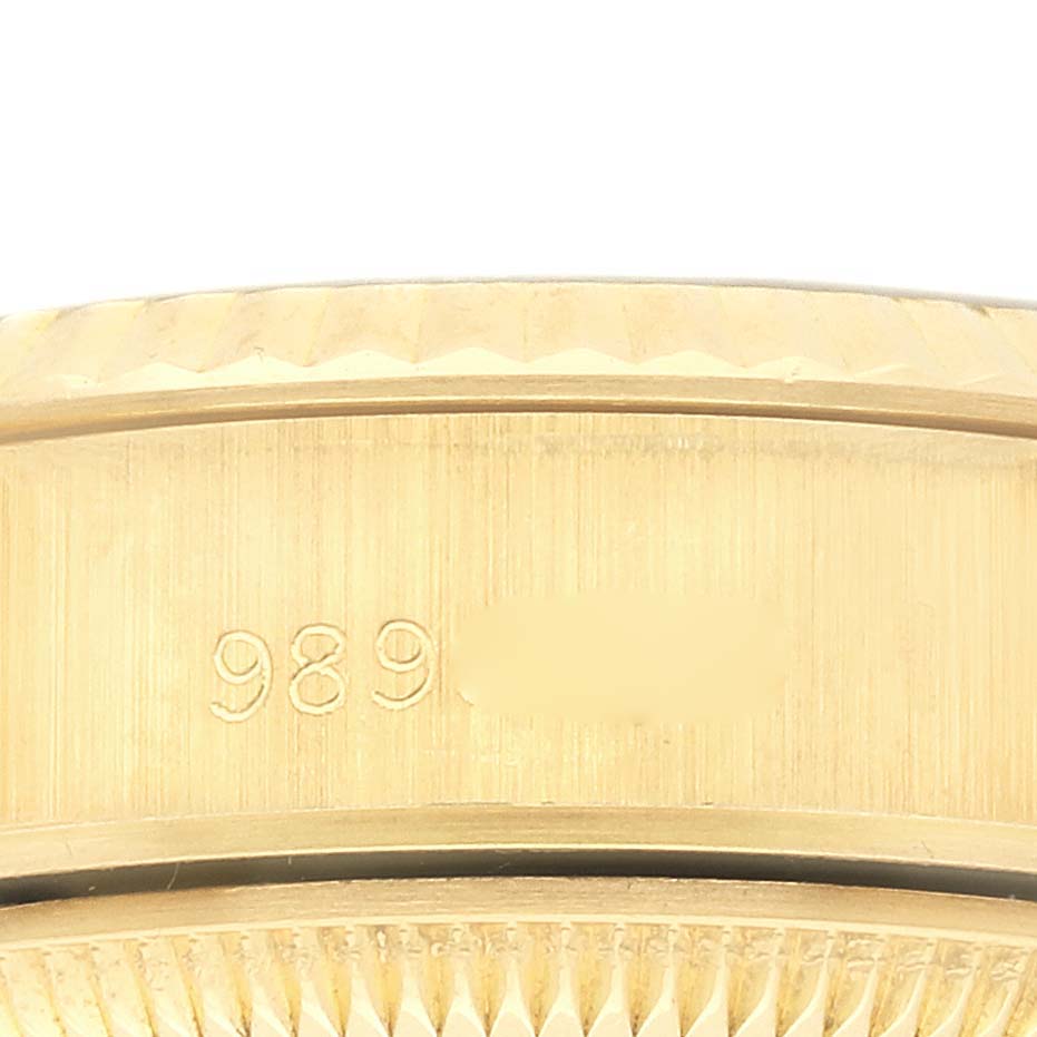 The image shows a close-up of the gold case edge and serial or model number of a Rolex President 69178 Women's Yellow Gold Champagne Dial 69178 Women's Yellow Gold Champagne Dial watch.