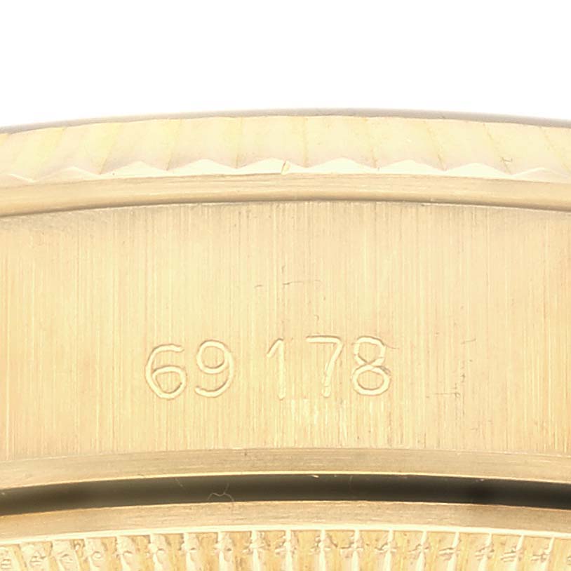 The image shows a close-up of the side of a Rolex President 69178 Women's Yellow Gold Champagne Dial 69178 Women's Yellow Gold Champagne Dial model, highlighting the engraved model number.