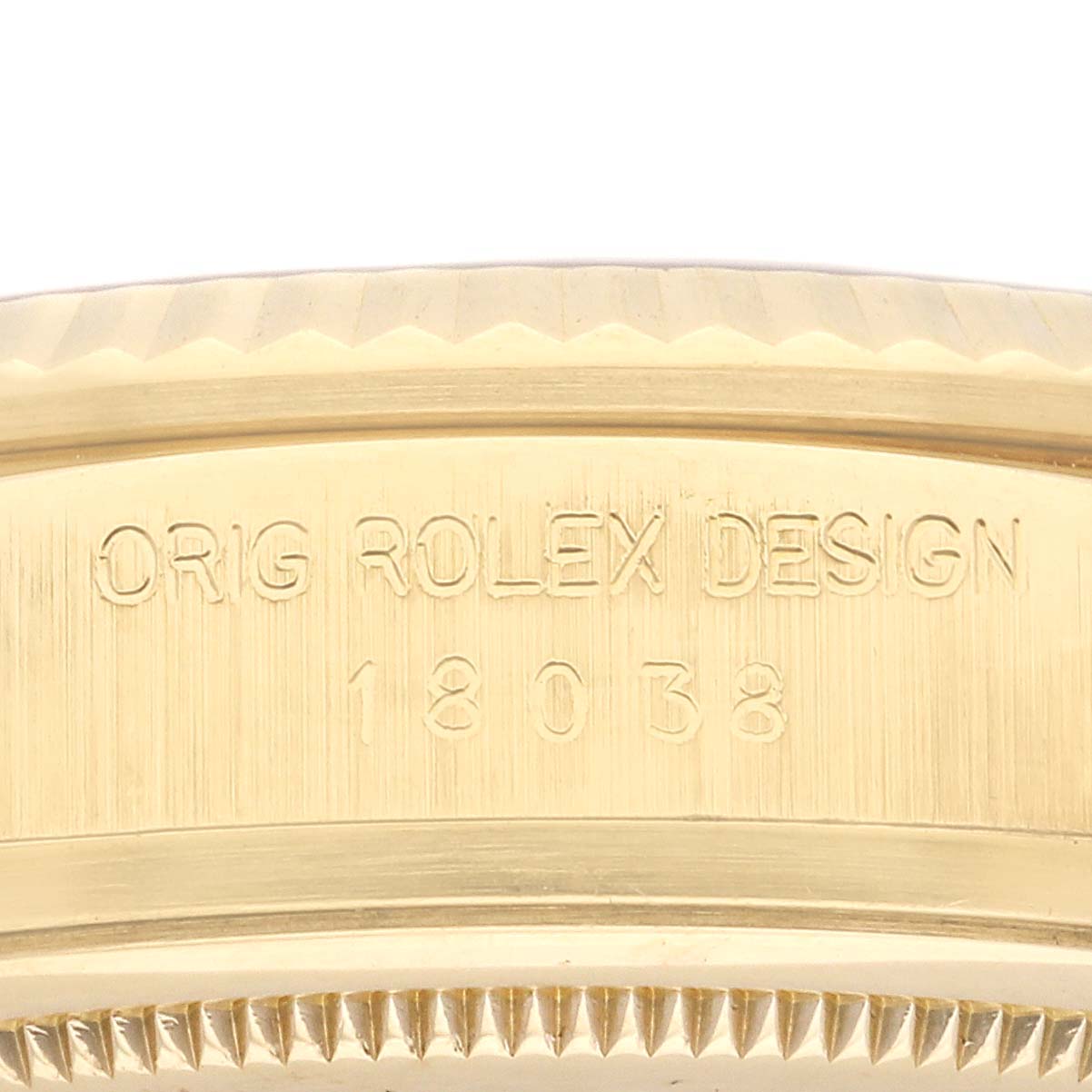 This image shows the side view of a Rolex President 18038 Men's Yellow Gold Silver Dial 18038 Men's Yellow Gold Silver Dial model, highlighting its engravings and bezel detail.