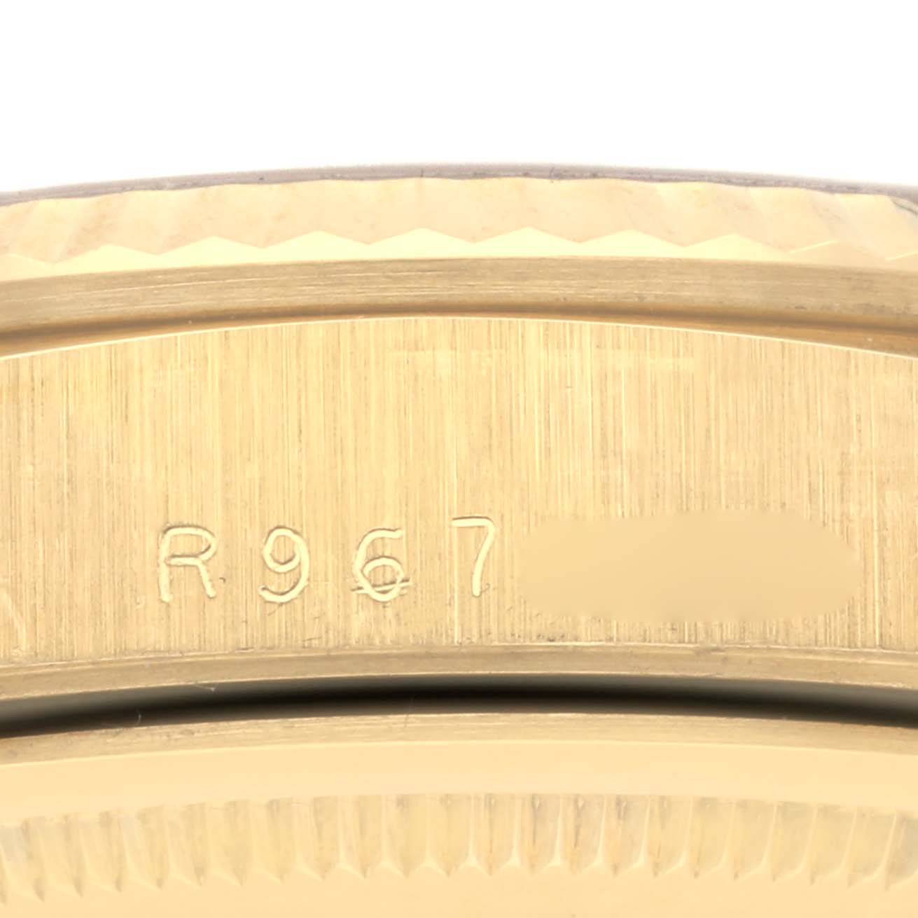 The image shows the side engraving of a Rolex President 18238 Men's Yellow Gold Champagne Dial 18238 Men's Yellow Gold Champagne Dial watch case, highlighting its details and markings.