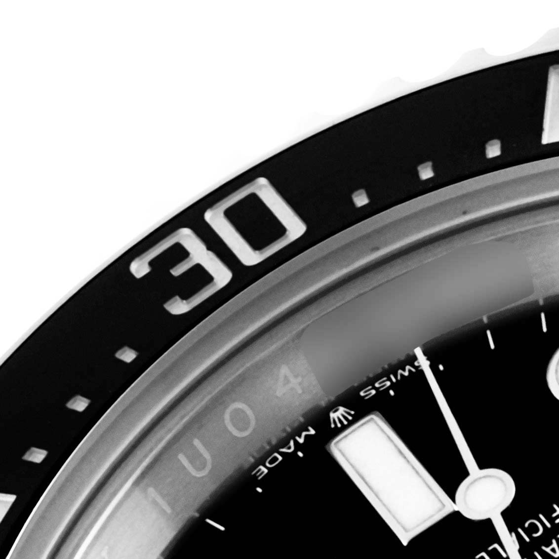 This close-up shows the bezel and part of the dial of the Rolex Sea-Dweller 126600 Men
s Stainless Steel Black Dial 126600 Men
s Stainless Steel Black Dial watch.