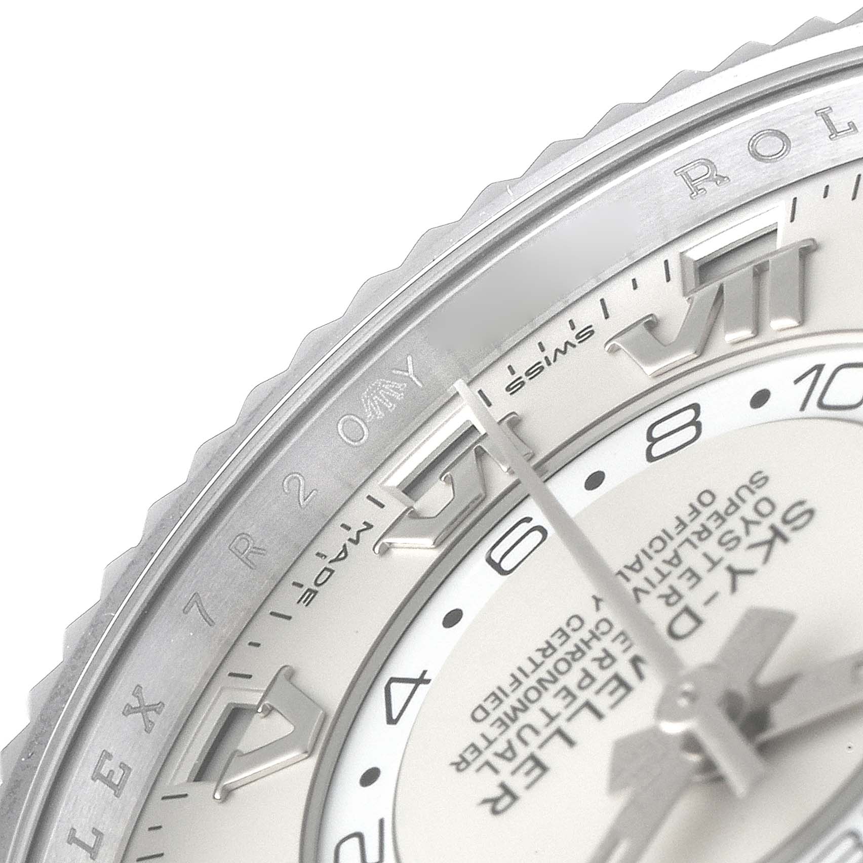 The image shows a close-up of the dial and bezel of a Rolex Sky-Dweller 326939 Men's White Gold White Dial 326939 Men's White Gold White Dial, highlighting the Roman numerals and brand name.