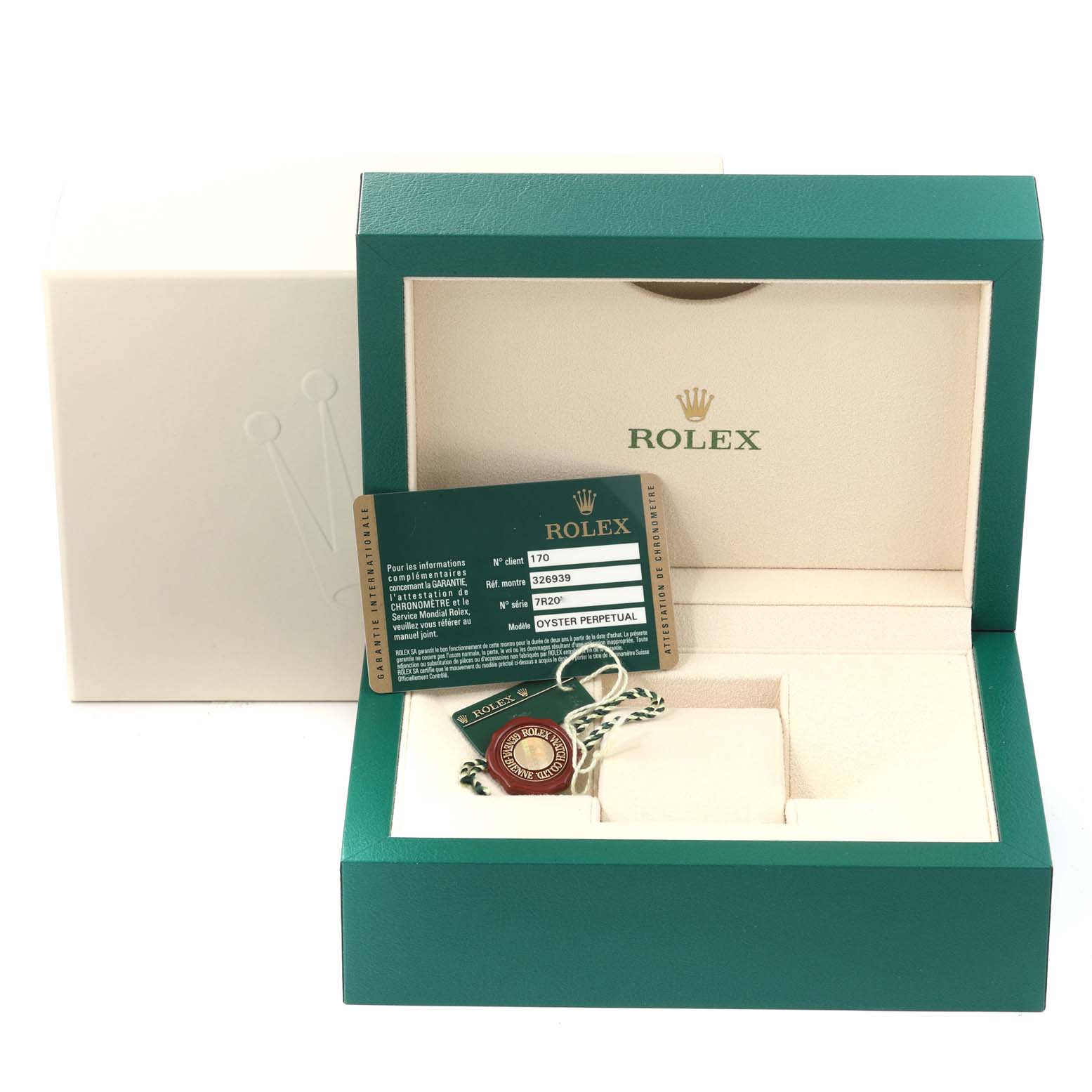 The image shows an open Rolex box with tags and a card for the Sky-Dweller model, but no watch is present.
