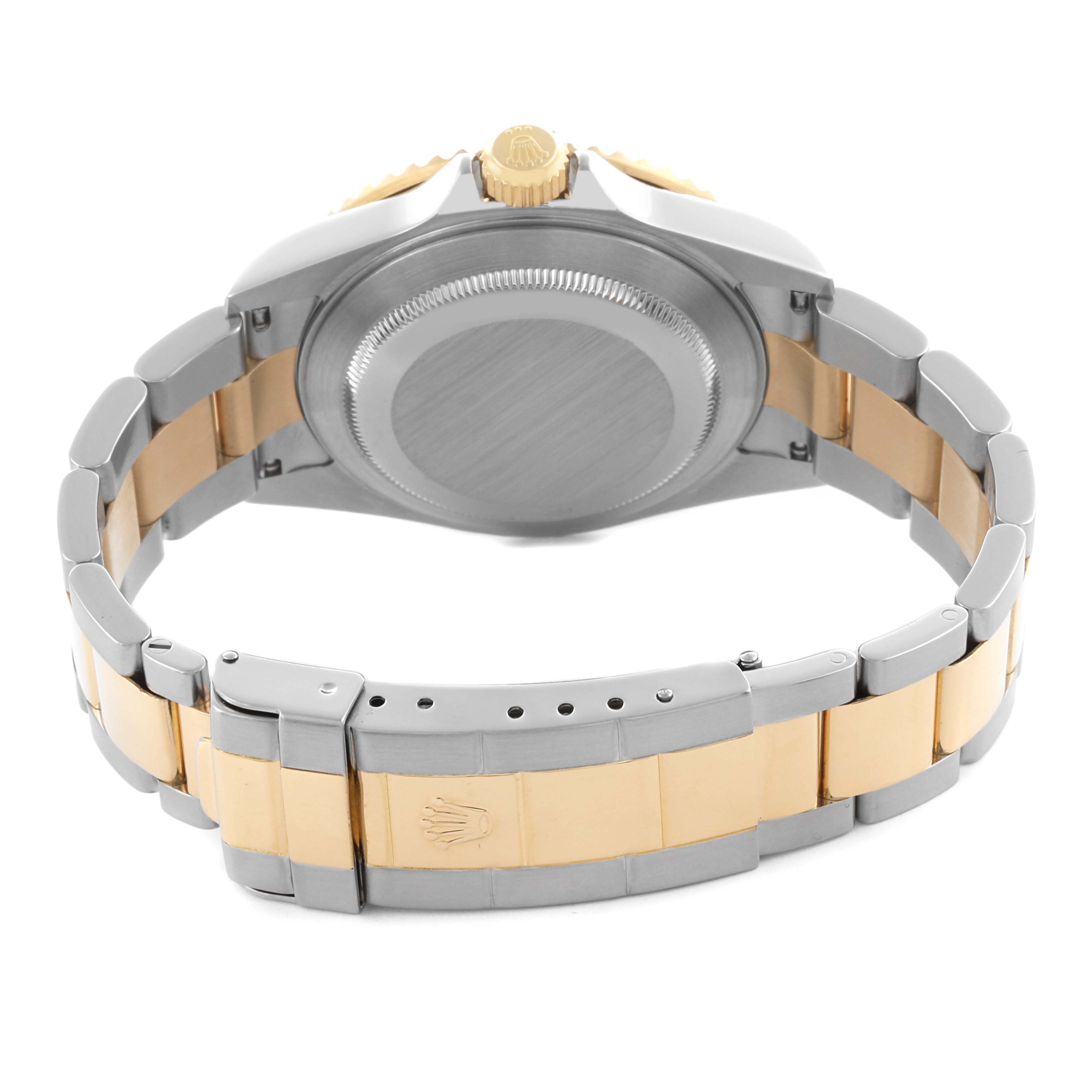 The image shows the back case and bracelet of a Rolex Submariner 16613 Men's Steel and Gold (two tone) Blue Dial 16613 Men's Steel and Gold (two tone) Blue Dial, viewed from an angle emphasizing the crown and clasp.