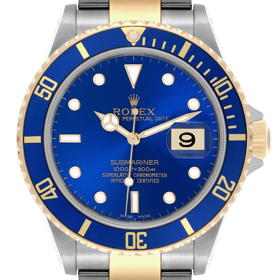 The image shows a frontal view of a Rolex Submariner watch, highlighting its blue dial, gold accents, and date magnifier.