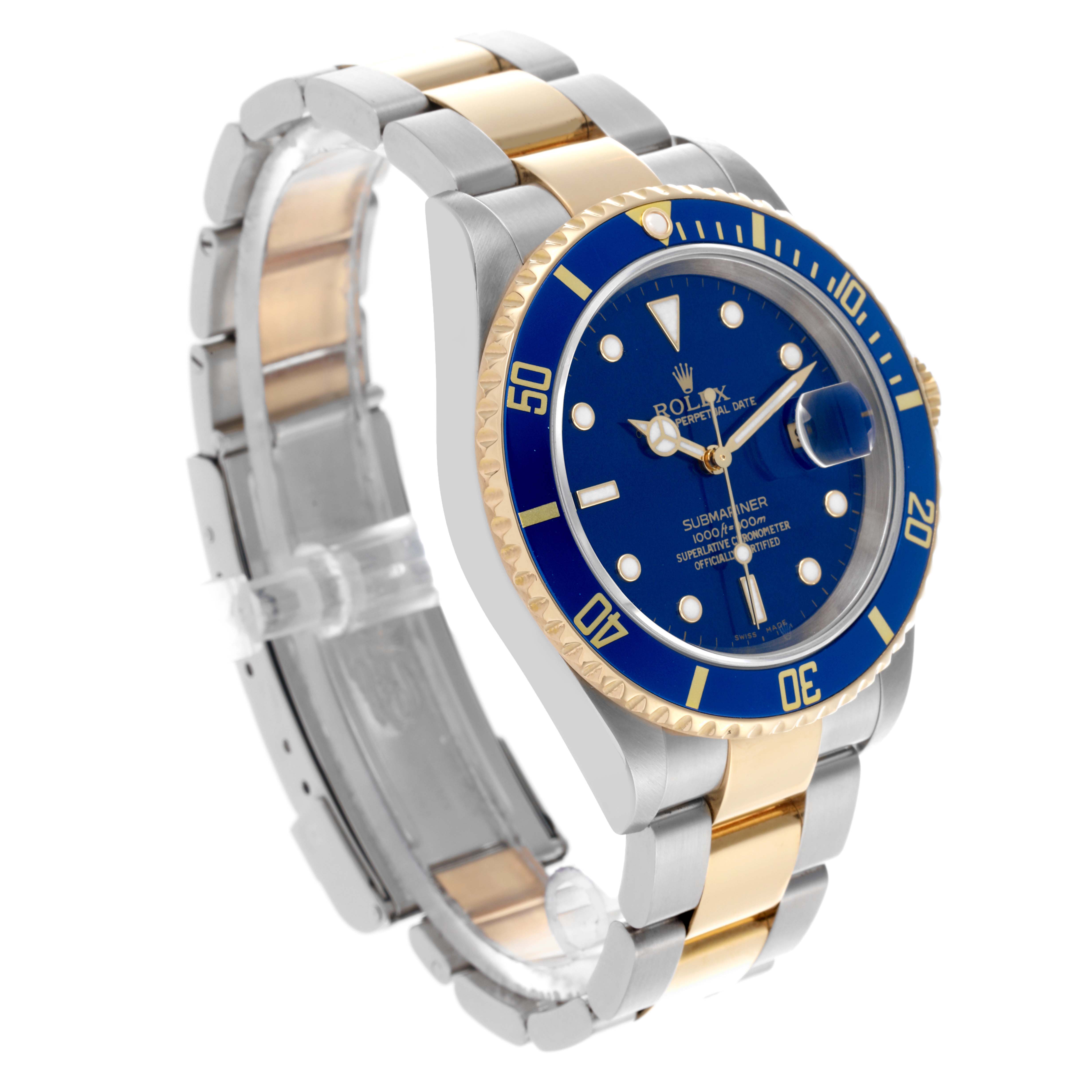 The Rolex Submariner 16613 Men's Steel and Gold (two tone) Blue Dial 16613 Men's Steel and Gold (two tone) Blue Dial watch is shown from a three-quarter angle, highlighting the bezel, dial, and two-tone bracelet.