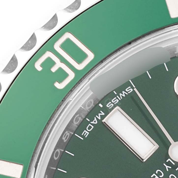 The image shows a close-up of a Rolex Submariner 116610LV Men's Stainless Steel Green Dial 116610LV Men's Stainless Steel Green Dial, focusing on the green bezel, the number "30," and part of the dial.