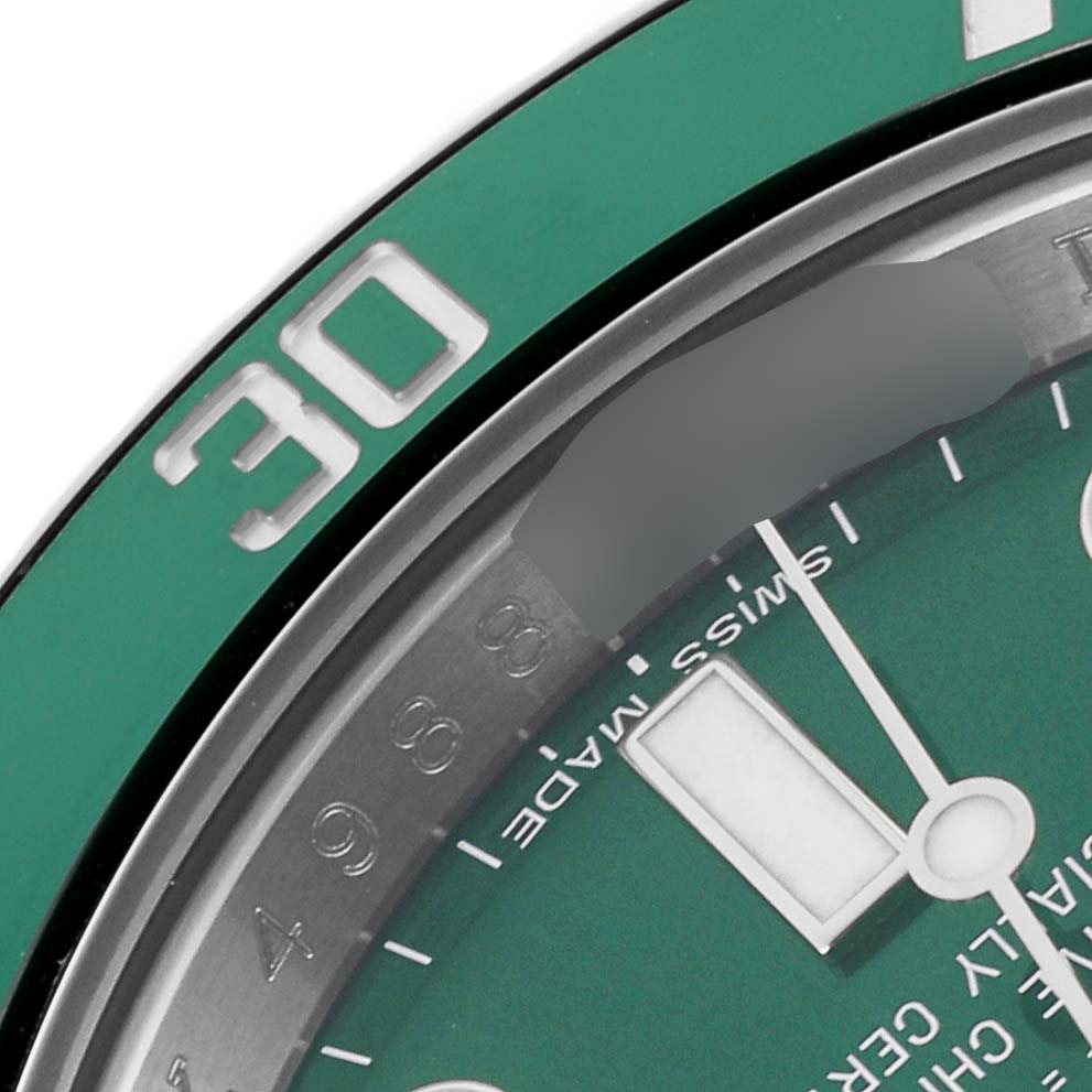 The image shows a close-up angle of the Rolex Submariner 116610LV Men's Stainless Steel Green Dial 116610LV Men's Stainless Steel Green Dial, highlighting the green bezel and partial view of the dial.