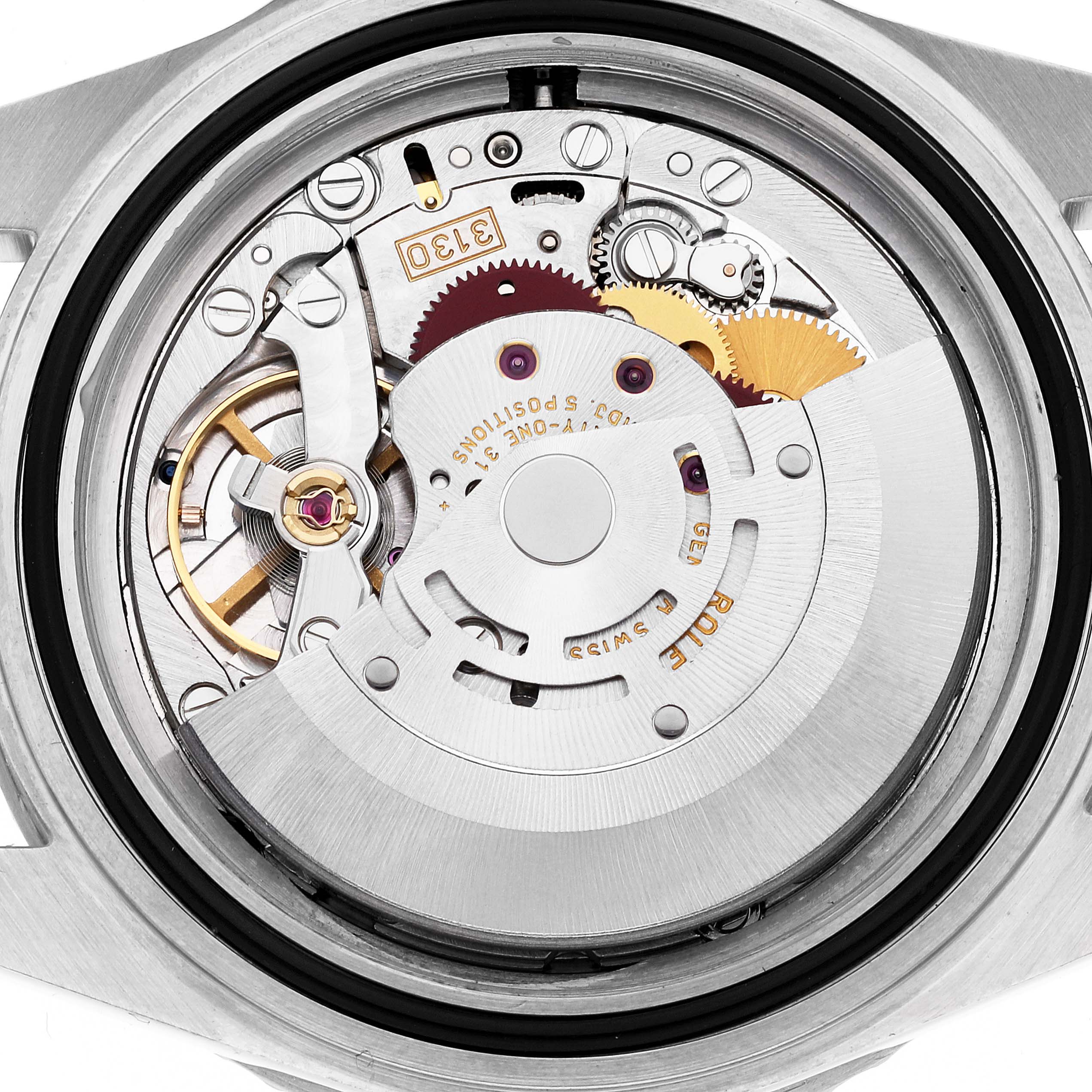 The image shows the intricate movement mechanism of a Rolex Submariner 14060M Men
s Stainless Steel Black Dial 14060M Men
s Stainless Steel Black Dial watch from the back view.