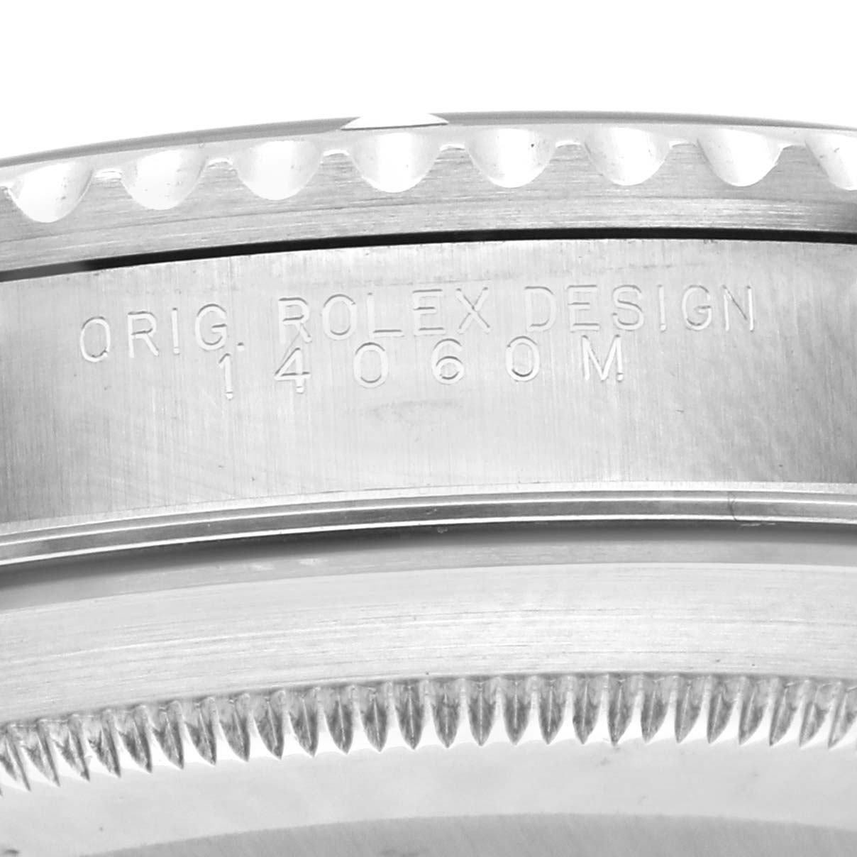 The image shows a close-up angle of the side of a Rolex Submariner 14060M Men's Stainless Steel Black Dial 14060M Men's Stainless Steel Black Dial, highlighting the model number engraving.
