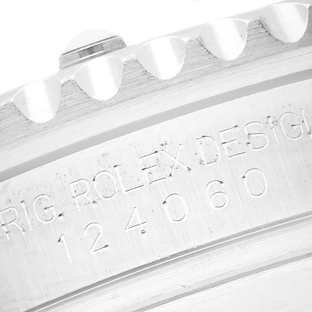 The image shows a close-up of the side of a Rolex Submariner 124060 Men's Stainless Steel Black Dial 124060 Men's Stainless Steel Black Dial, highlighting the model number and part of the bezel.