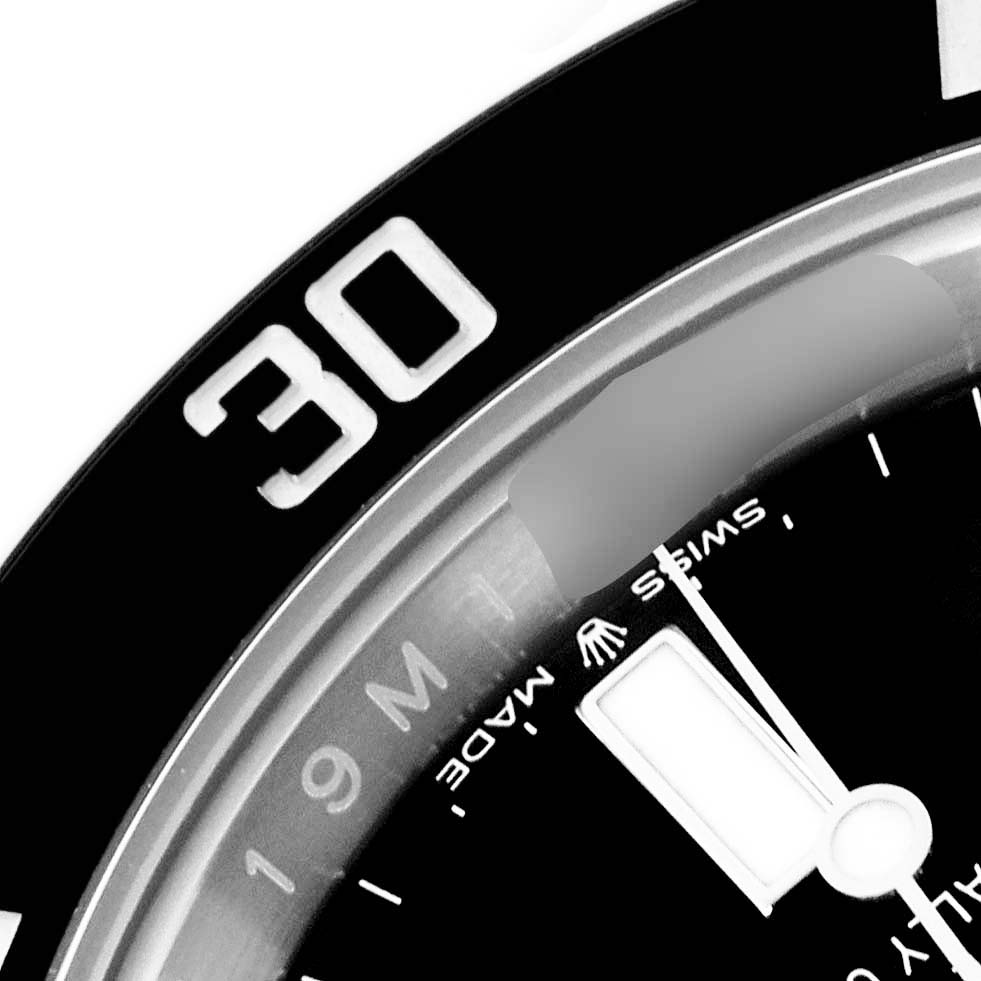 The image shows a close-up of the bezel and part of the dial of a Rolex Submariner 124060 Men's Stainless Steel Black Dial 124060 Men's Stainless Steel Black Dial watch, highlighting the 30-minute marker.