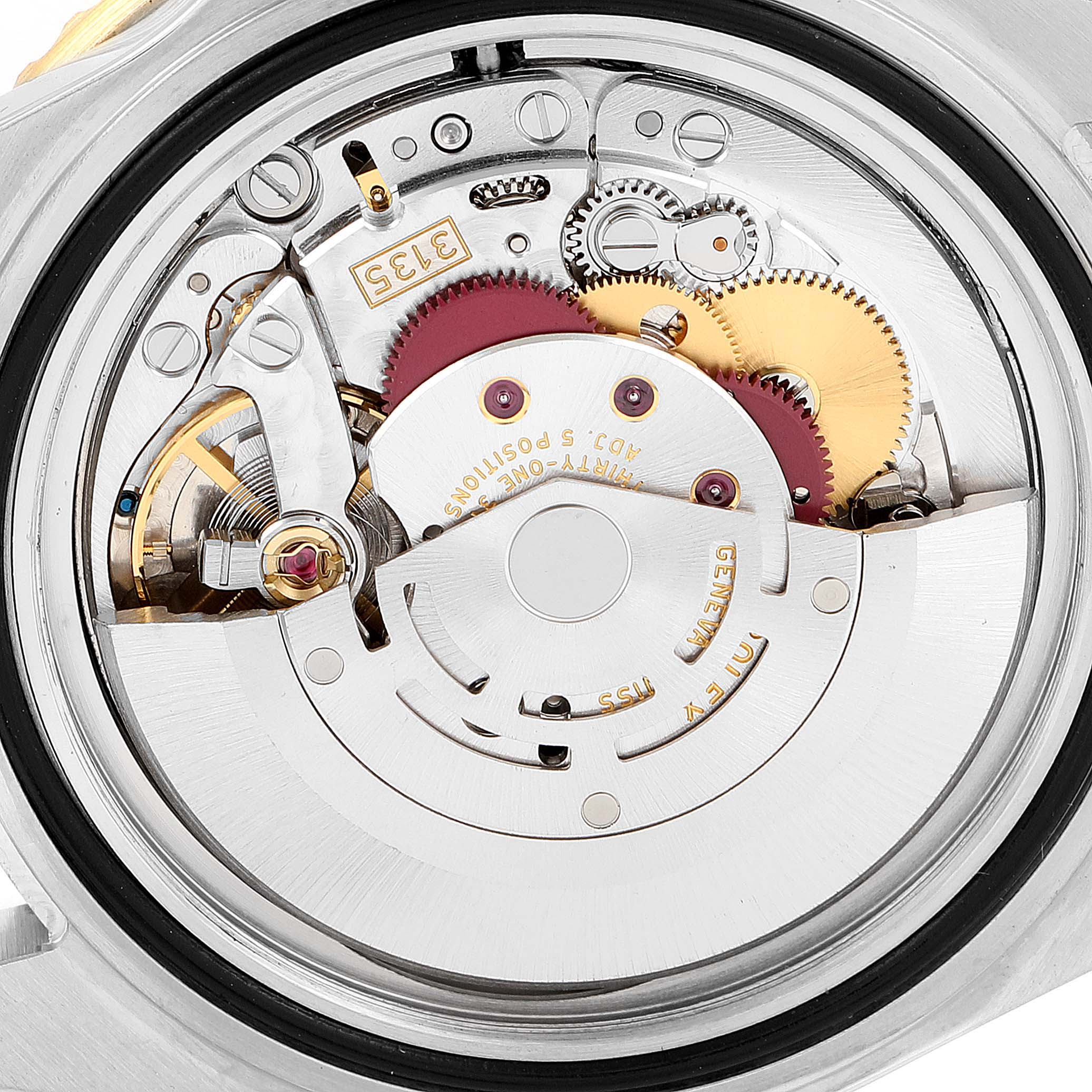 This image shows the inner mechanism and movement parts of a Rolex Submariner 16613 Men's Steel and Gold (two tone) Blue Dial 16613 Men's Steel and Gold (two tone) Blue Dial watch from a close-up angle.