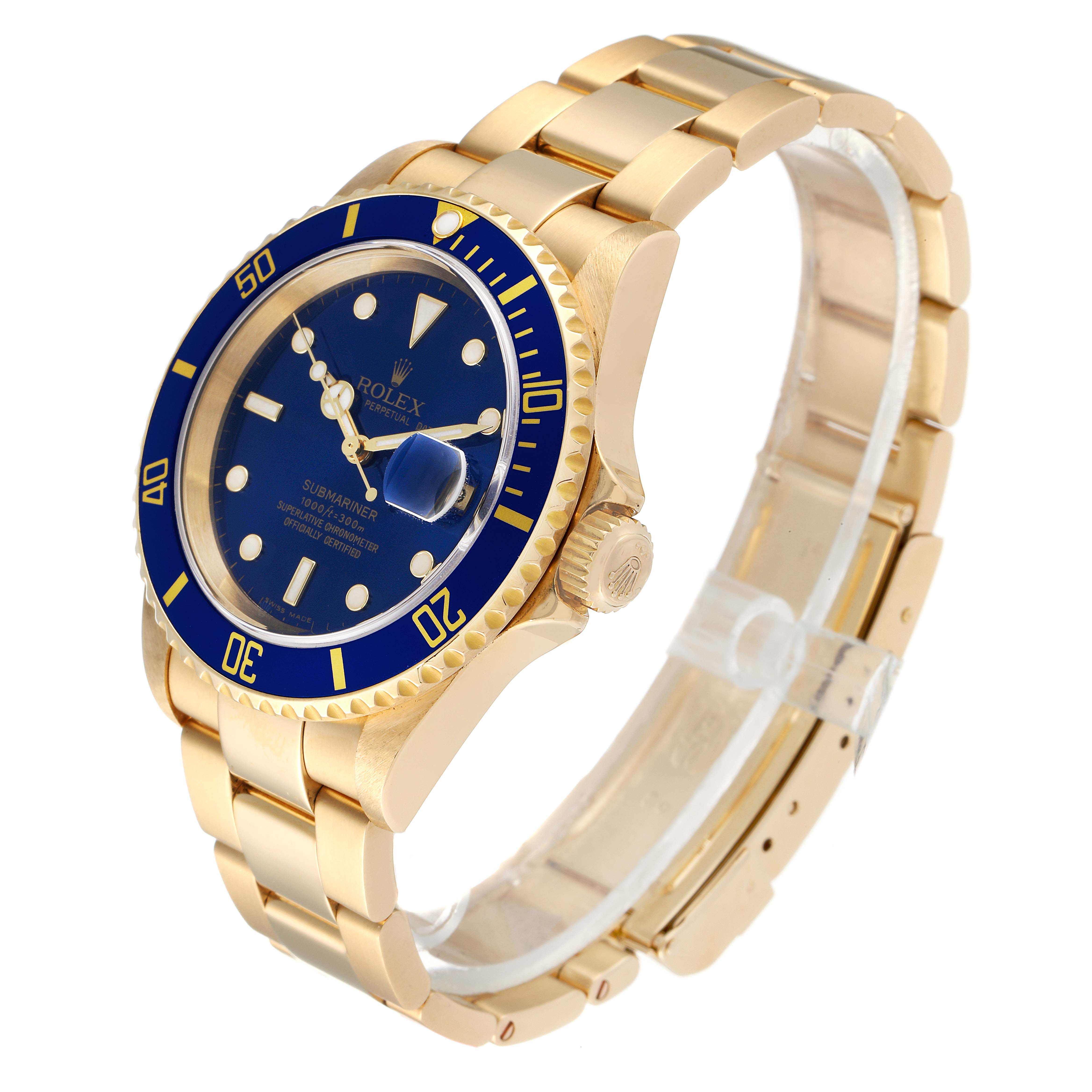 This image shows a Rolex Submariner 16618 Men
s Yellow Gold Blue Dial 16618 Men
s Yellow Gold Blue Dial watch at a three-quarter angle, highlighting its blue dial, bezel, and gold bracelet.