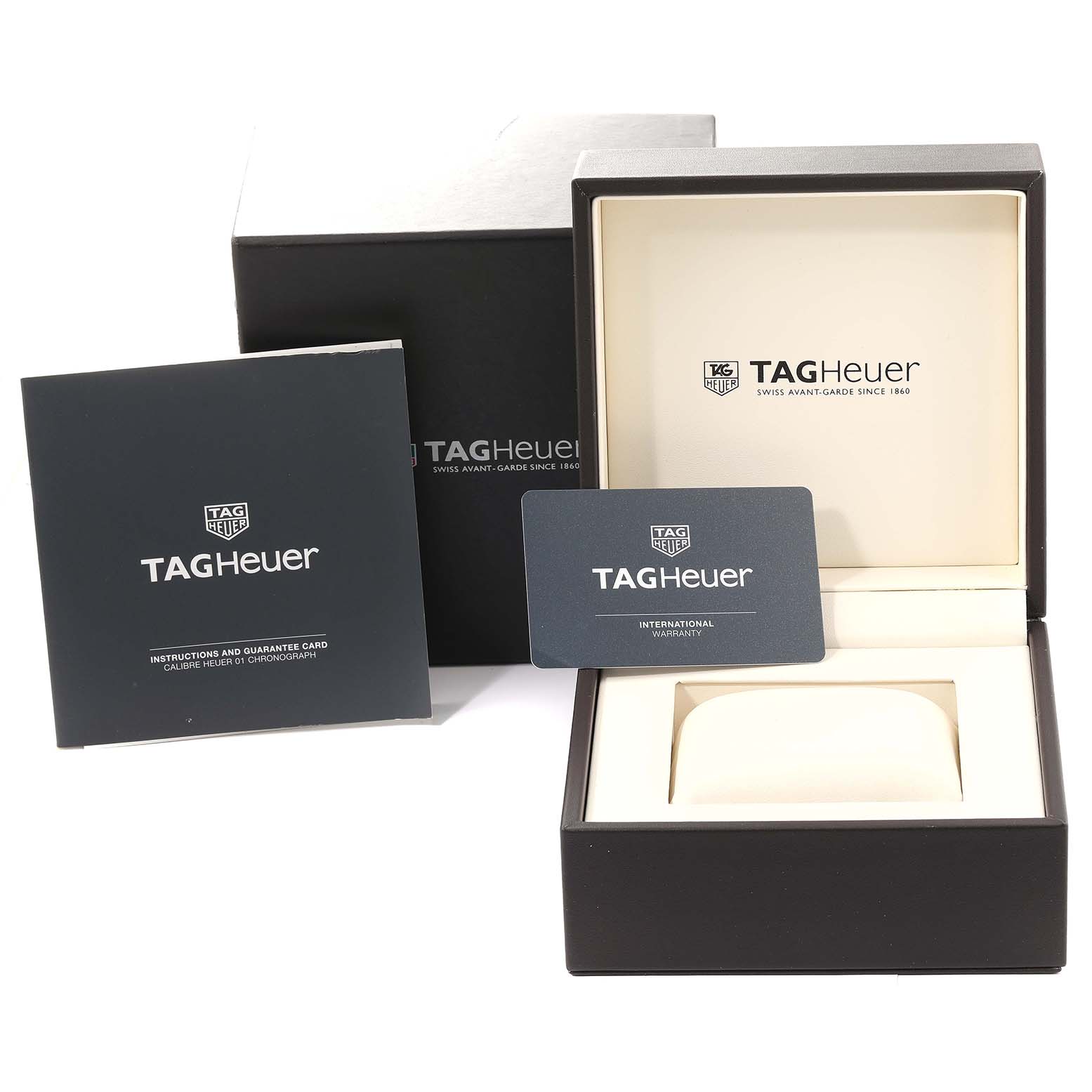 The image shows the packaging, instruction manual, and warranty card for a Tag Heuer Carrera CAR2A1T.FT6052 Men's Stainless Steel Black Dial CAR2A1T.FT6052 Men's Stainless Steel Black Dial watch.