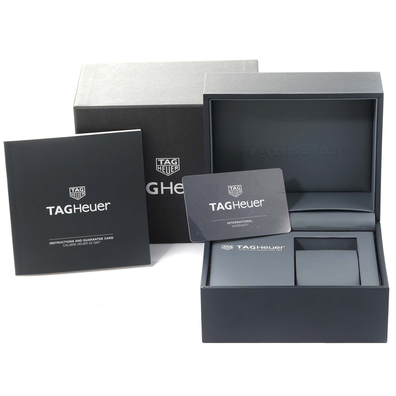 The image shows a Tag Heuer Carrera CBG2A1Z.BA0658 Men's Stainless Steel Black Dial CBG2A1Z.BA0658 Men's Stainless Steel Black Dial watch's packaging, international warranty card, and instruction manual.