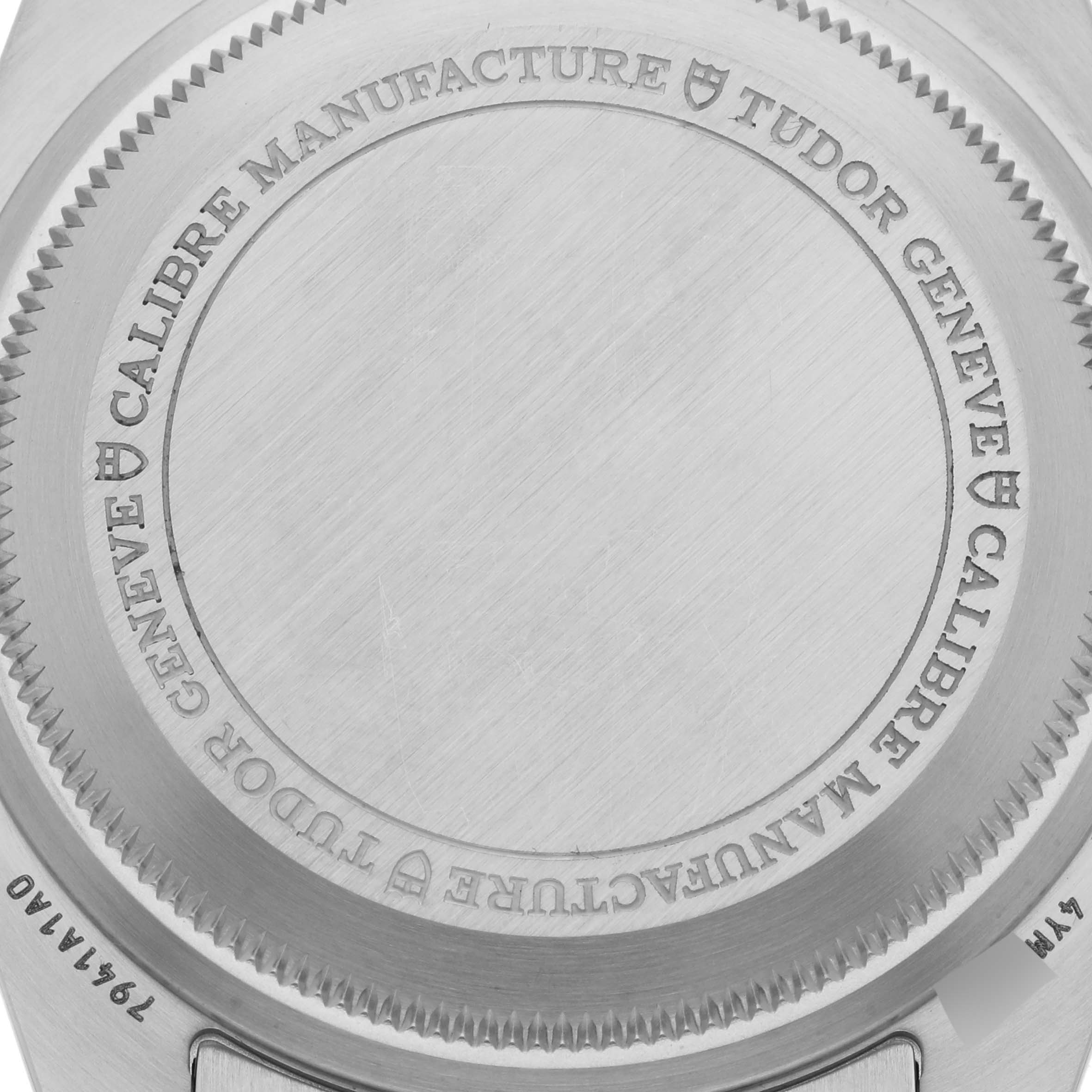 The image shows the back case of the Tudor Heritage Black Bay 7941A1A0NU Men's Stainless Steel Black Dial 7941A1A0NU Men's Stainless Steel Black Dial watch, highlighting the engraved text.