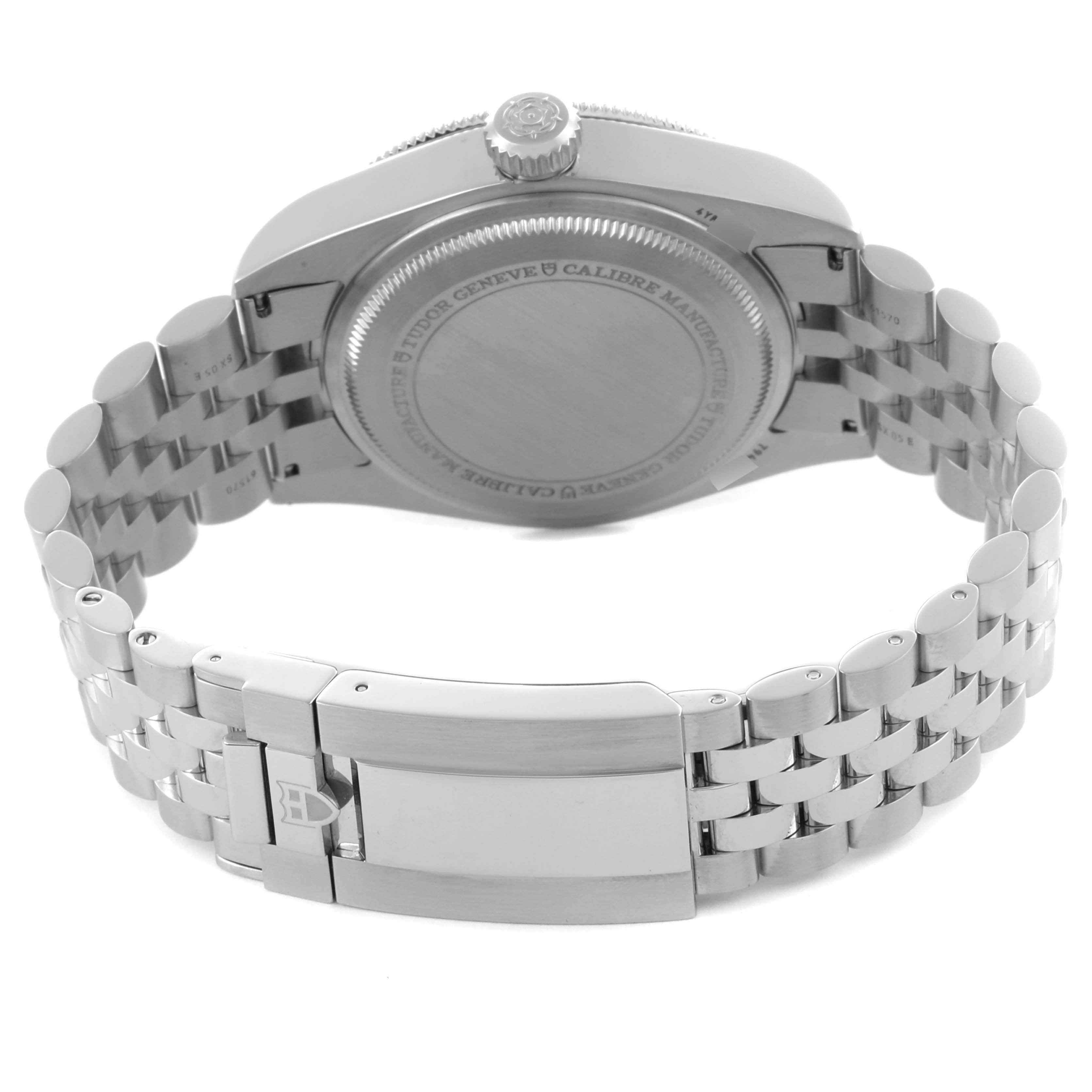 The image shows the back and clasp of the Tudor Heritage Black Bay 7941A1A0NU Men's Stainless Steel Black Dial 7941A1A0NU Men's Stainless Steel Black Dial watch, highlighting its stainless steel bracelet and case back.