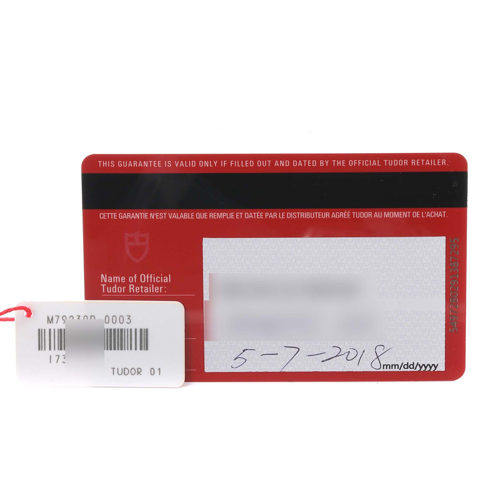 The image shows the warranty card and a tag for the Tudor Heritage Black Bay 79230R-0003 Men's Stainless Steel Black Dial 79230R-0003 Men's Stainless Steel Black Dial watch, viewed from the front.