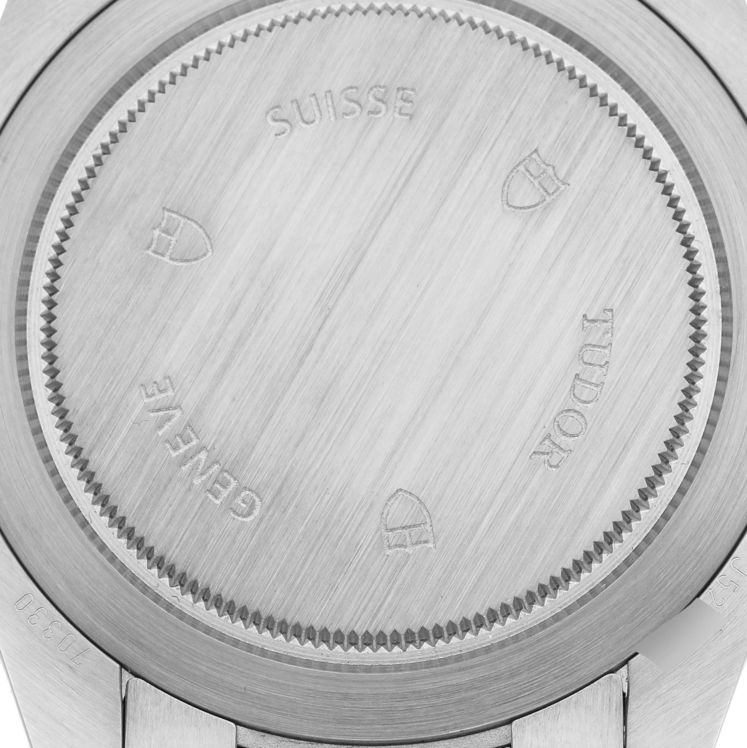 The image shows the case back of the Tudor Heritage Chrono 70330N-65740 Men's Stainless Steel Grey Dial 70330N-65740 Men's Stainless Steel Grey Dial watch with engravings and markings visible.