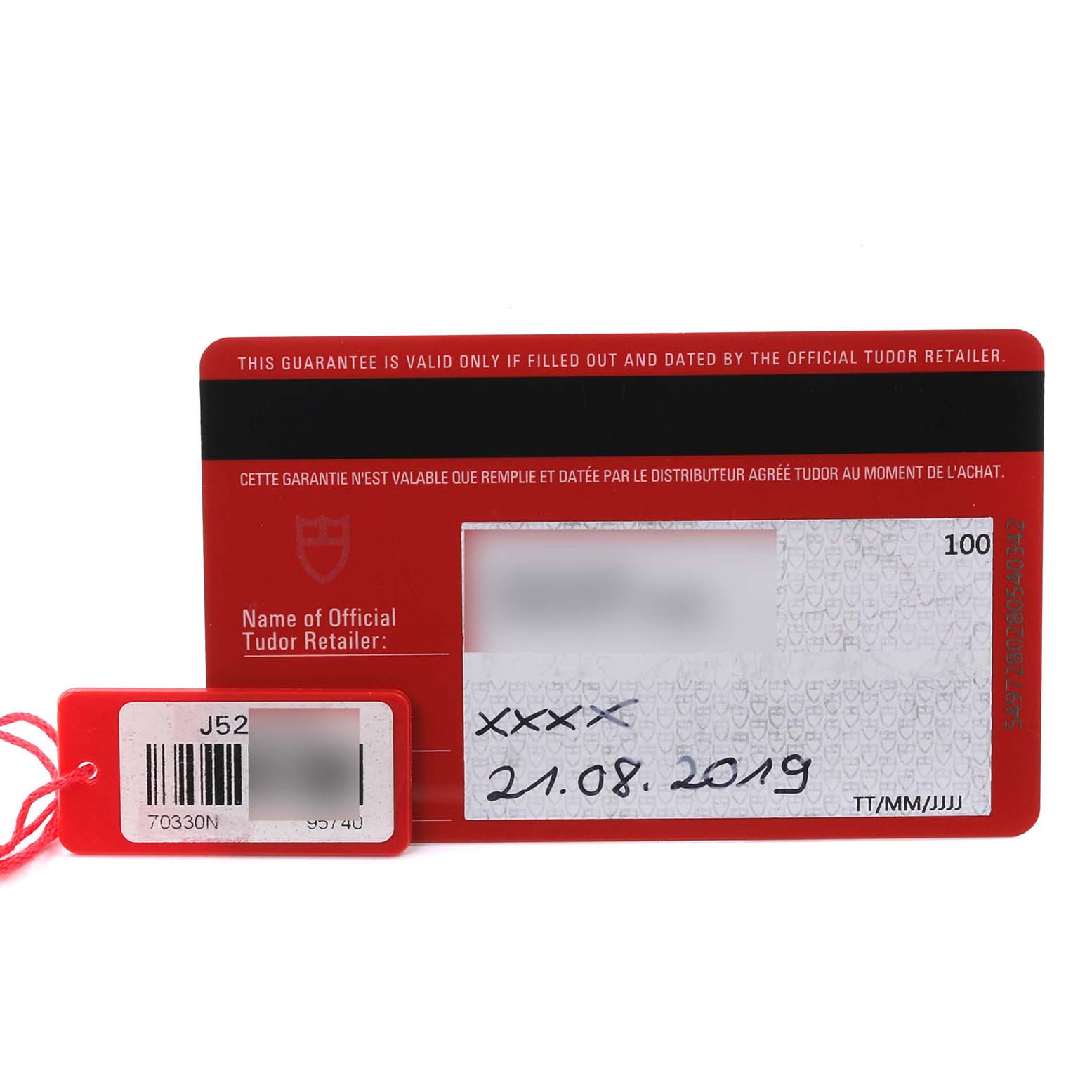 The image shows a Tudor Heritage Chrono 70330N-65740 Men's Stainless Steel Grey Dial 70330N-65740 Men's Stainless Steel Grey Dial warranty card and a red tag with product details.