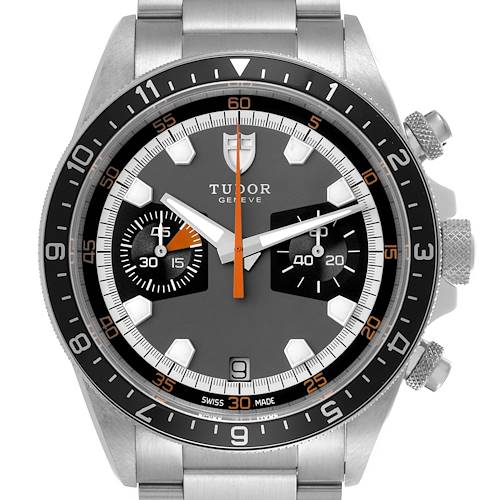The Tudor Heritage Chrono watch is shown from the front, highlighting the dial, bezel, and pushers.