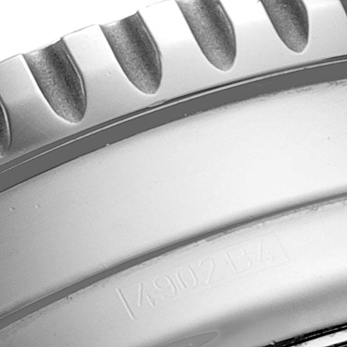 This close-up image shows the bezel and part of the case of a Breitling Navitimer A22322 Men
s Stainless Steel Silver Dial A22322 Men
s Stainless Steel Silver Dial watch, highlighting its knurled edge.