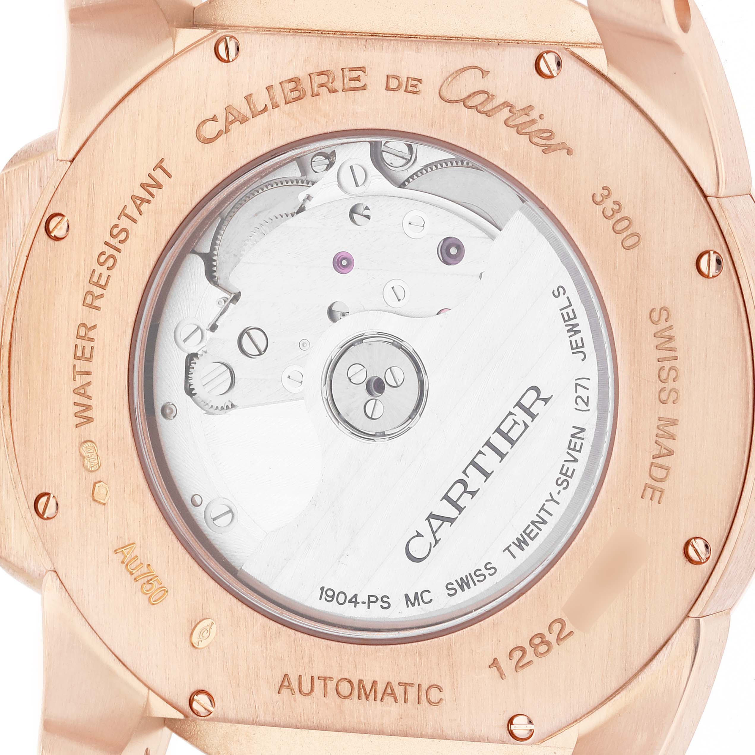 This image shows a close-up of the back casing and movement of a Calibre de Cartier watch by Cartier.