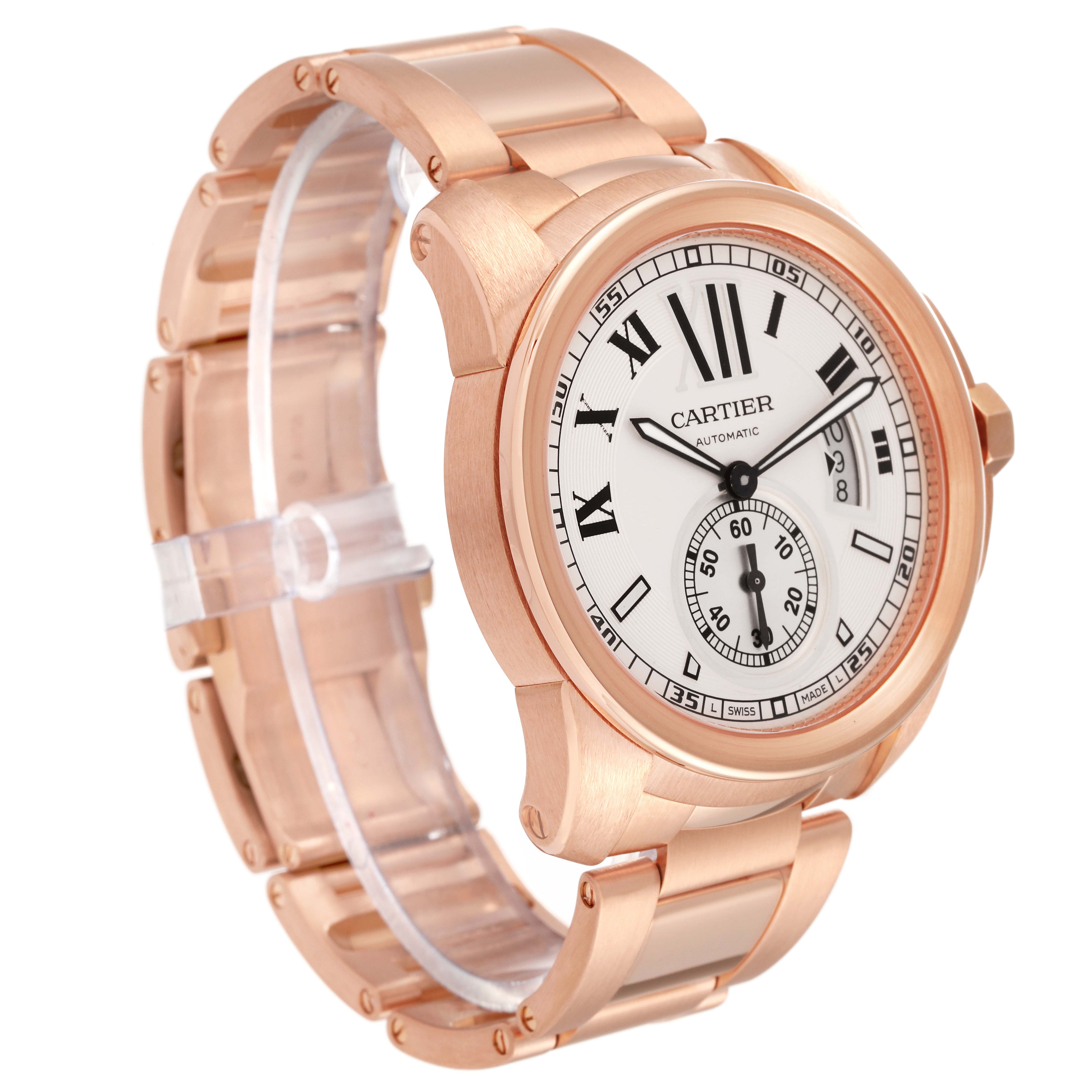 The image shows a Calibre de Cartier watch by Cartier from a three-quarter angle, displaying the dial, bracelet, and case.