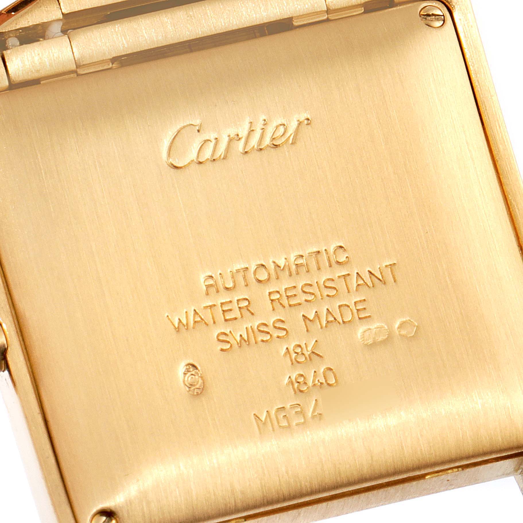 The image shows the engraved case back of a Cartier Tank Francaise W50001R2 Men's Yellow Gold Silver Dial W50001R2 Men's Yellow Gold Silver Dial watch, highlighting the branding and specifications.