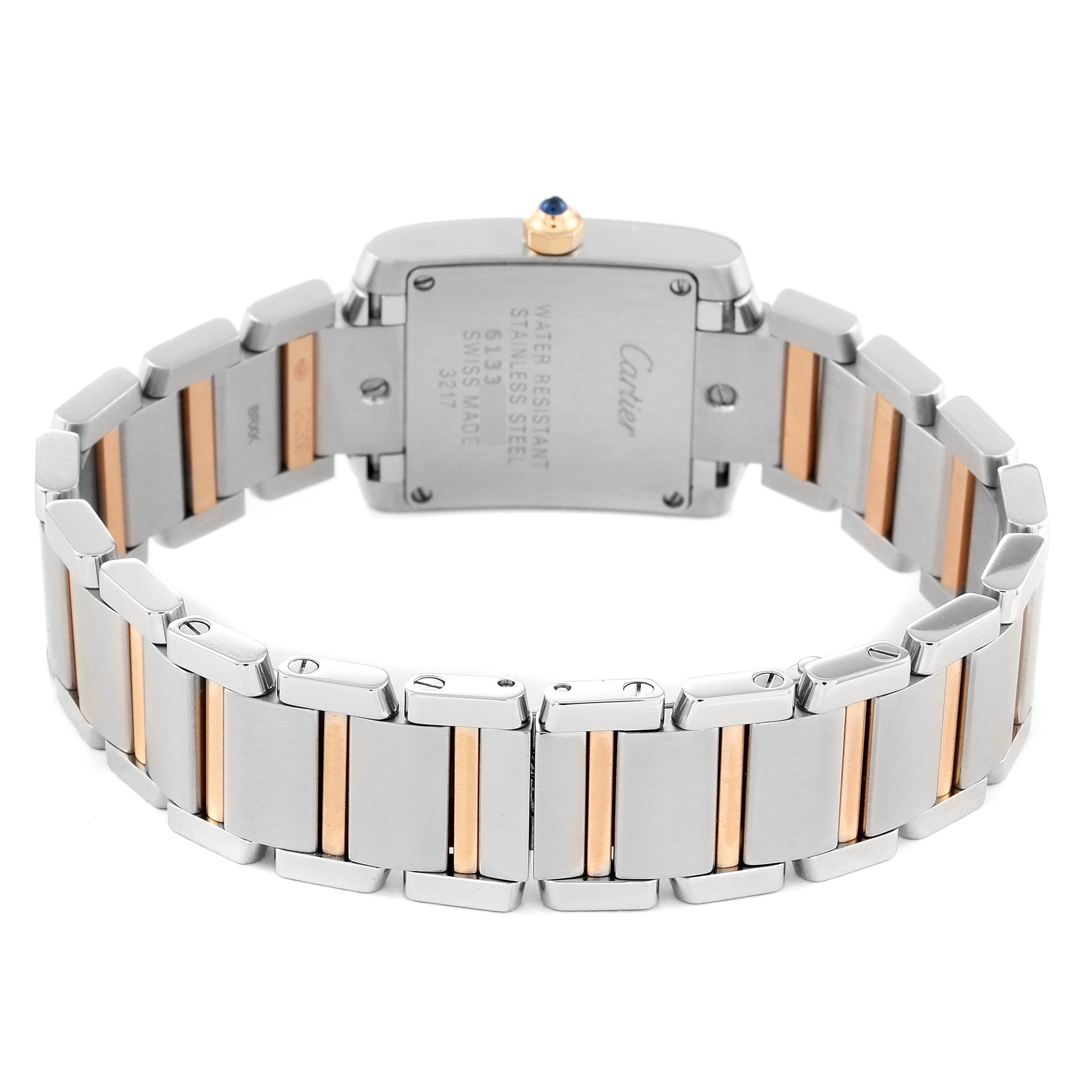 The image shows the back view of a Cartier Tank Francaise WE110004 Women
s Steel and Gold (two tone) Silver Dial WE110004 Women
s Steel and Gold (two tone) Silver Dial watch, highlighting its stainless steel and gold bracelet.