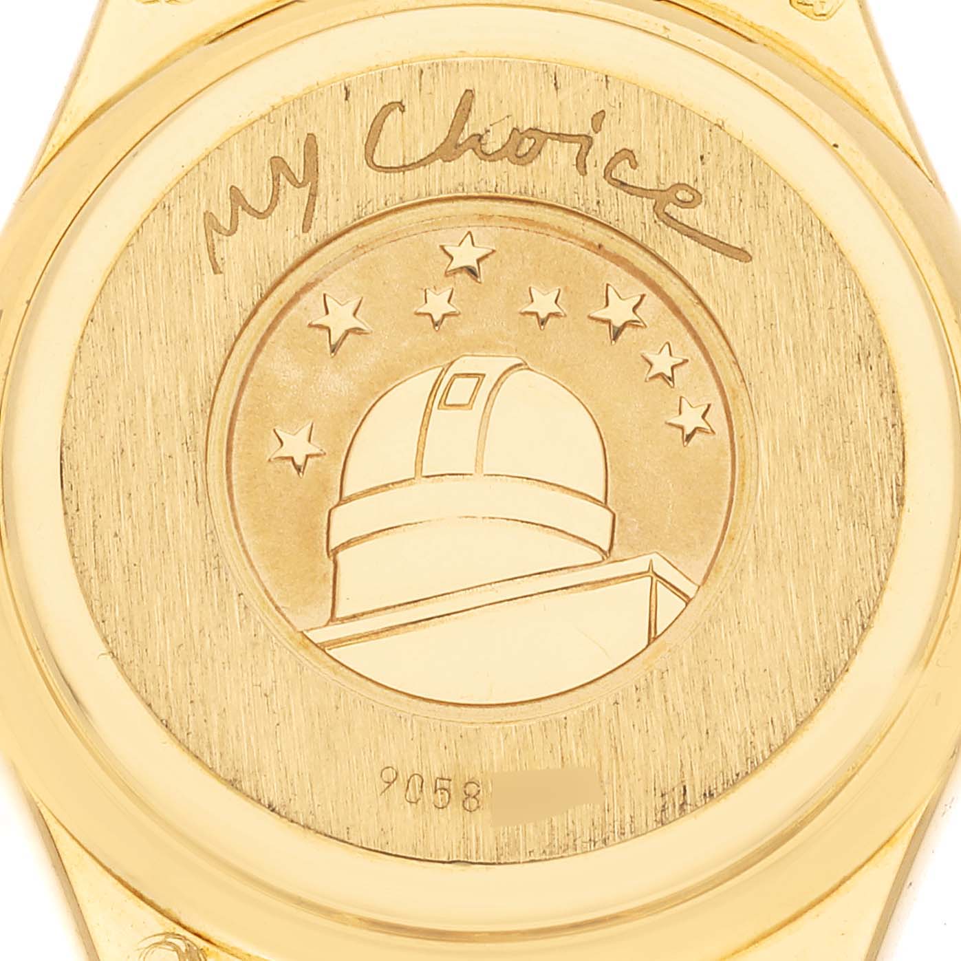 The image shows the engraved case back of the Omega 1164.79.00 Women's Yellow Gold Mother of Pearl Dial 1164.79.00 Women's Yellow Gold Mother of Pearl Dial Constellation Iris Yellow Gold Mother Of Pearl Multi Stone Diamond Ladies Watch 1164.79.00.