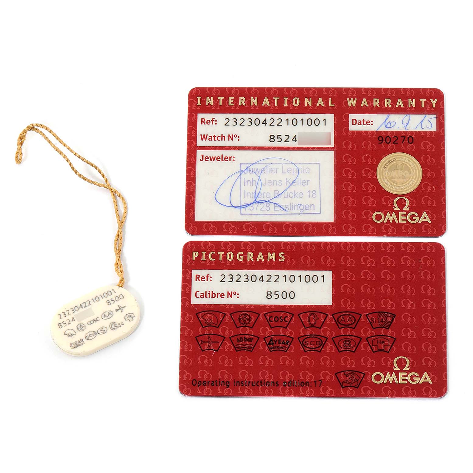 The image displays an International Warranty card, a Pictograms card, and a tag associated with the Omega Planet Ocean 232.30.42.21.01.001 Men
s Stainless Steel Black Dial 232.30.42.21.01.001 Men
s Stainless Steel Black Dial watch model.