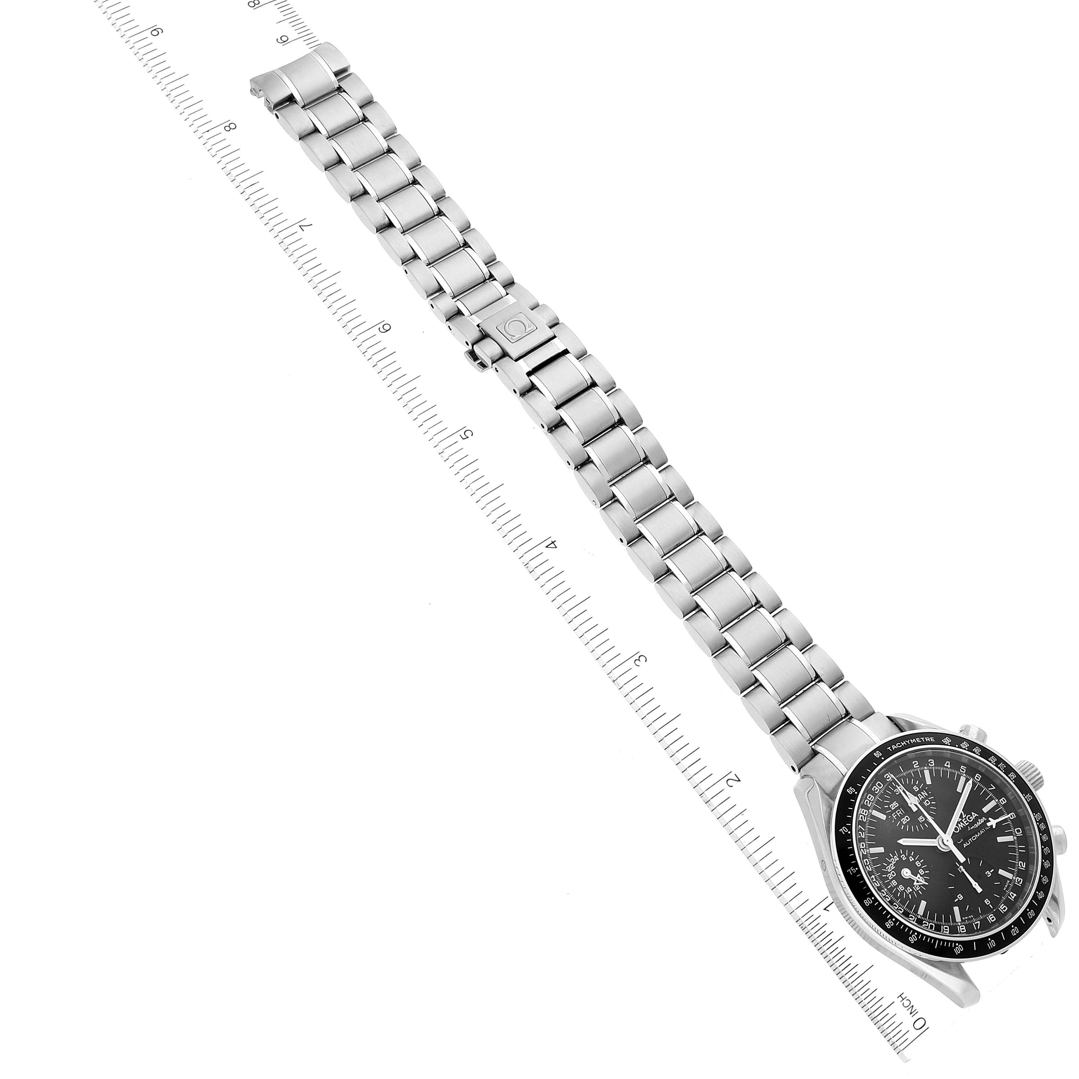 The image shows an Omega Speedmaster 3520.50.00 Men's Stainless Steel Black Dial 3520.50.00 Men's Stainless Steel Black Dial watch laid flat, showcasing its entire metal bracelet and face, with a measuring scale beside it.