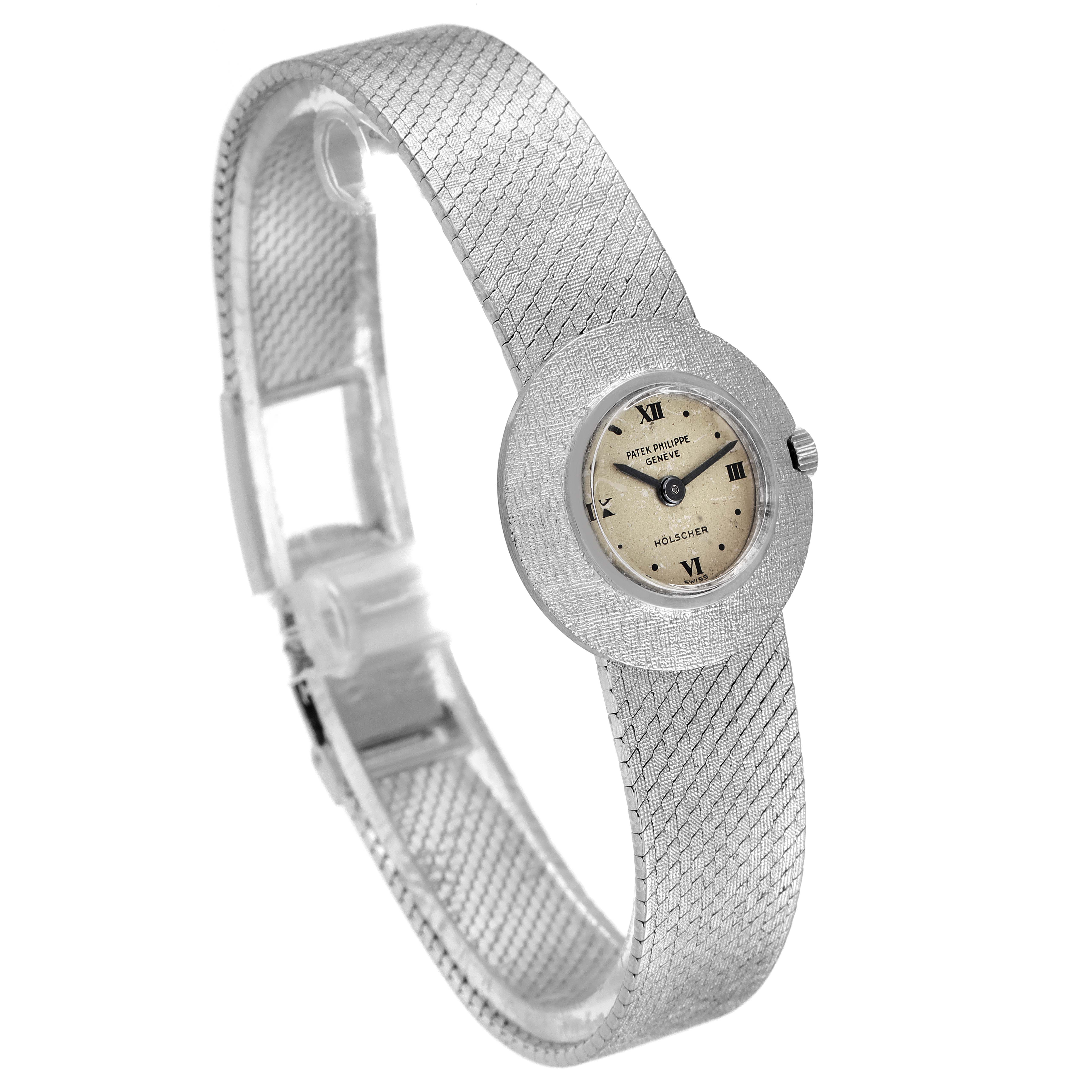 This Patek Philippe Calatrava 3344 Women's White Gold Silver Dial 3344 Women's White Gold Silver Dial watch is shown from a three-quarter angle, highlighting its face, dial, and intricate band design.